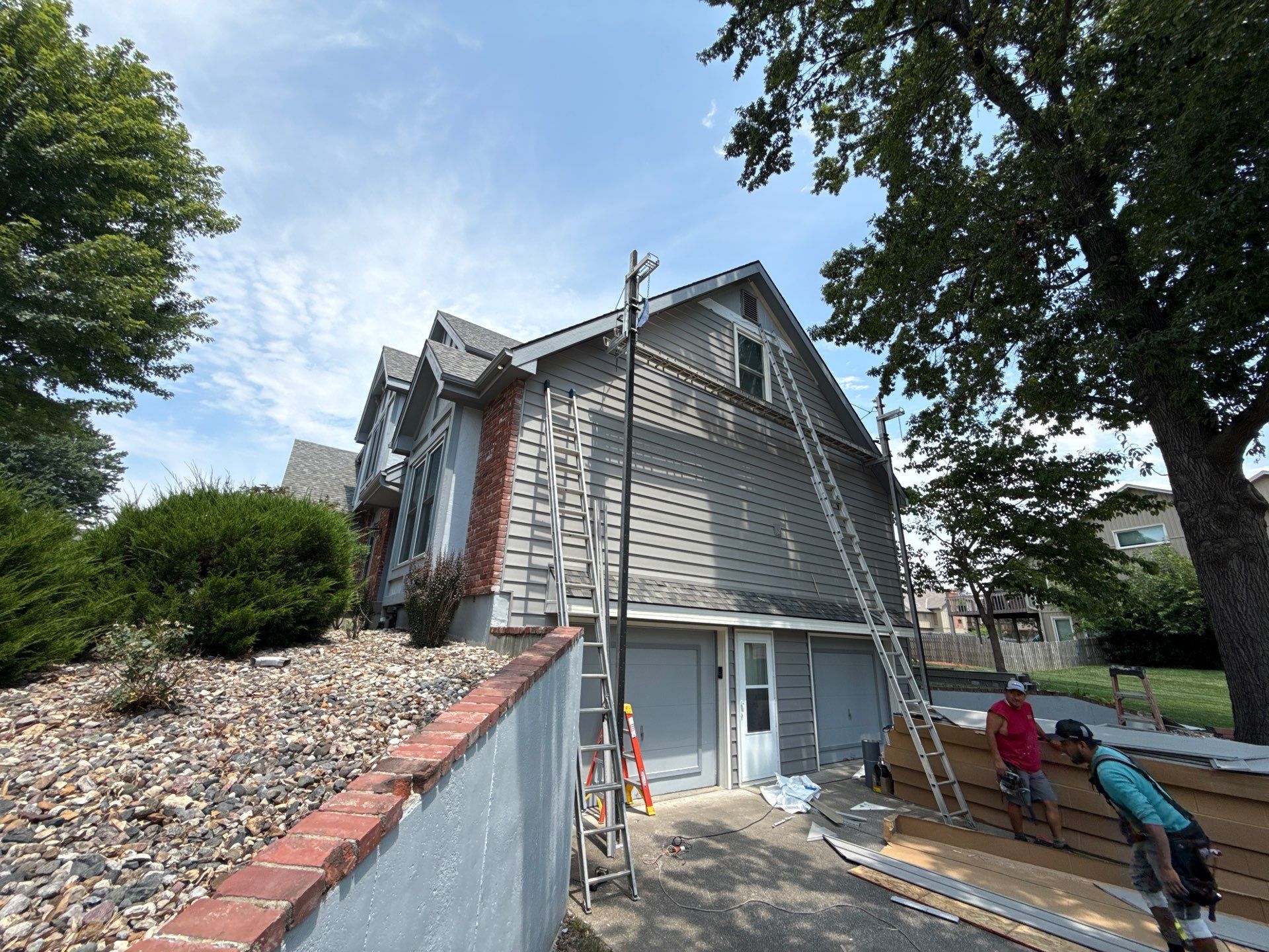 Whole Home Siding Replacement and Gutter Installation in Gladstone by EEC  Windows, Siding & Roofing 