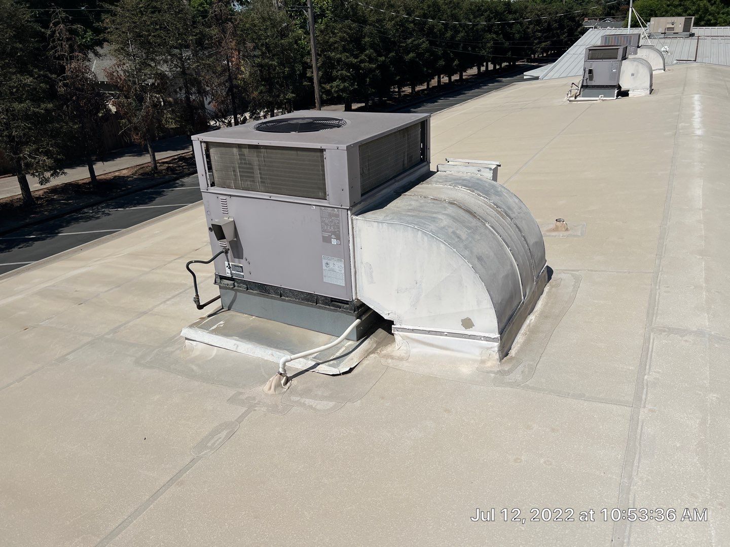 MR Roofing system using Benchmark/PUMA XL coatings over TPO single-ply roofing by Straight Edge Roofing Inc
