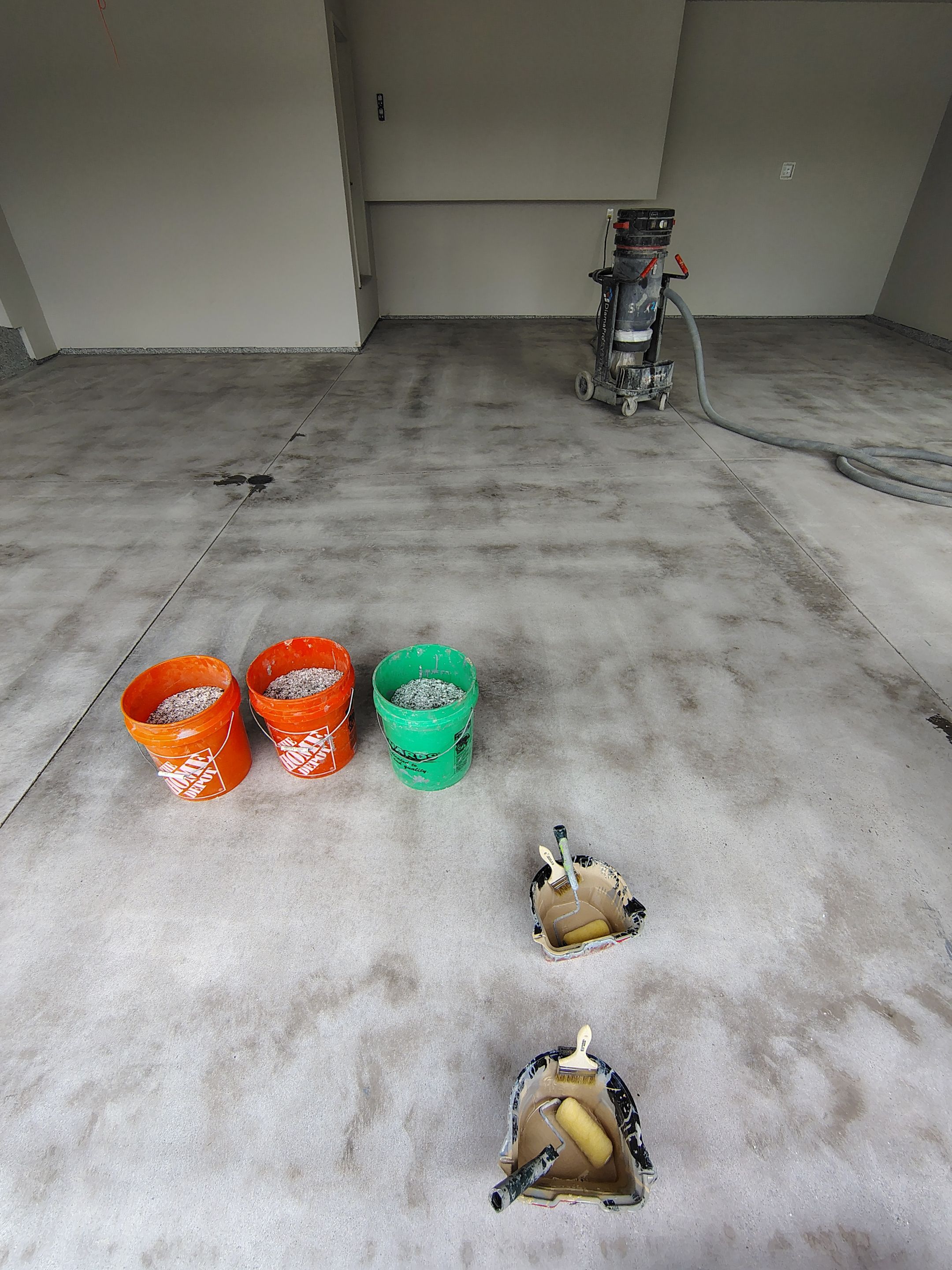 Grey Speckled Epoxy Garage Floor Coating in Sioux Falls by Select Painting, Coatings & Garage Cabinets