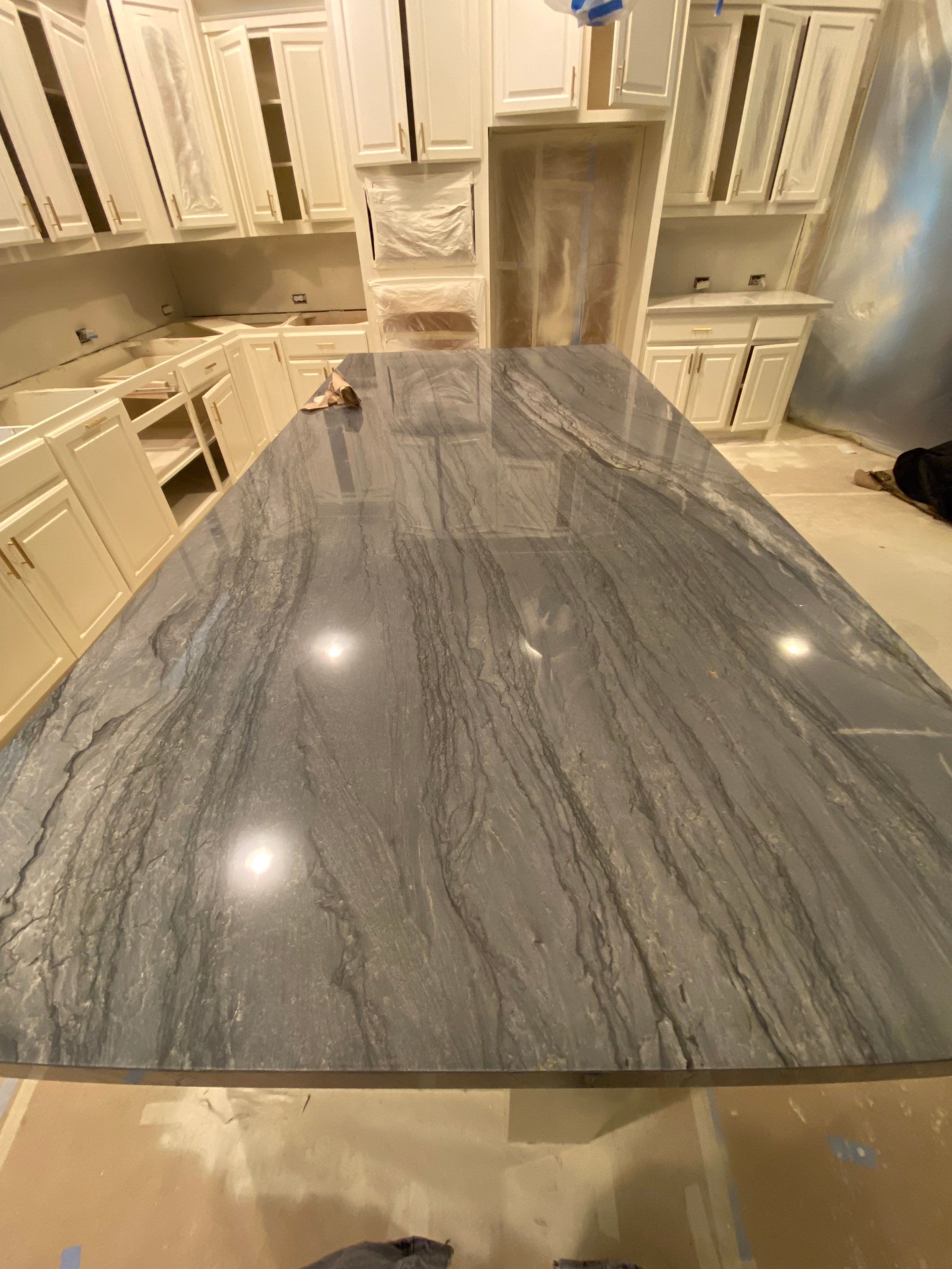 Kitchen Remodel using Quartzite by SLM General Contractors & Roofing