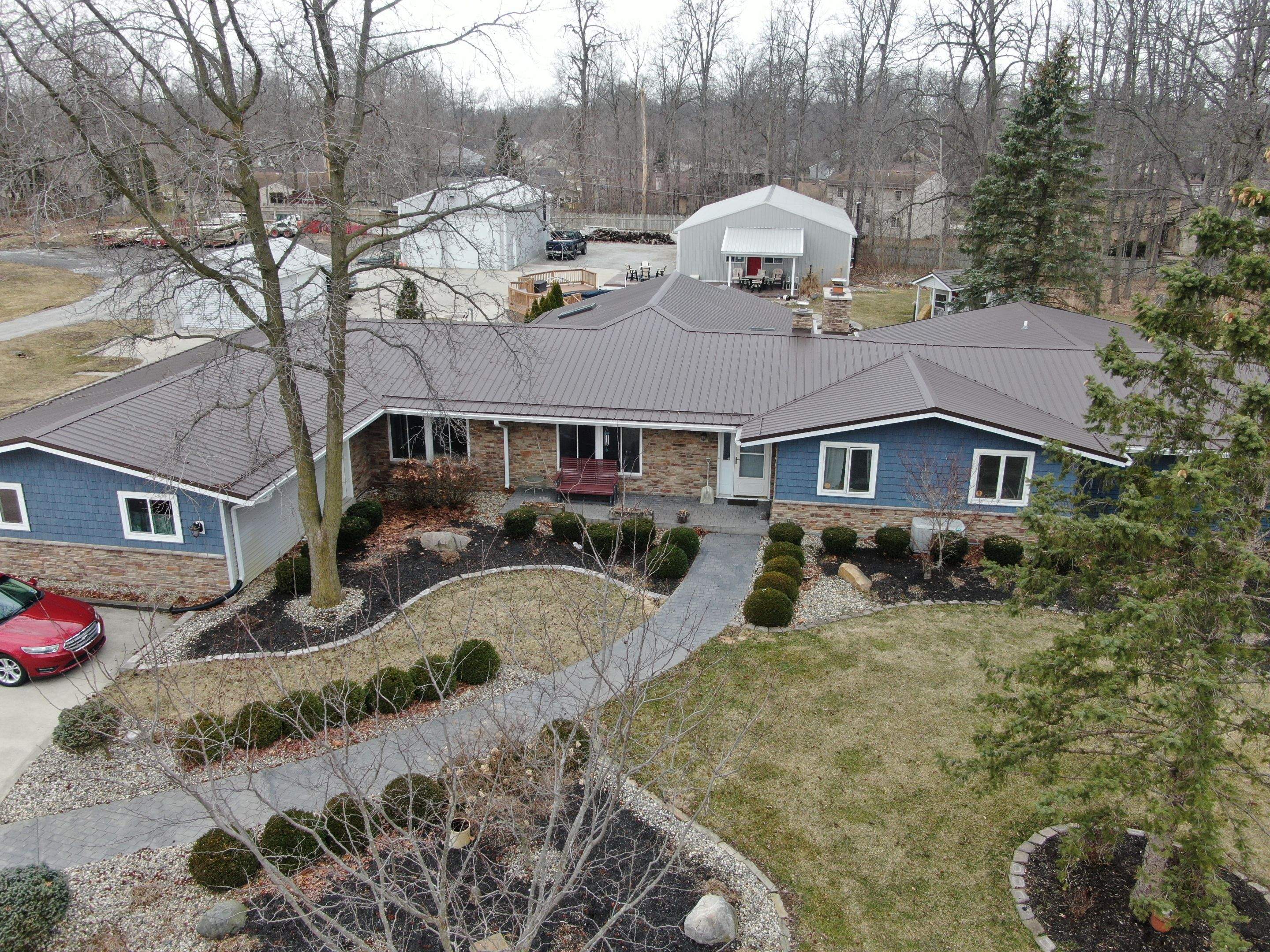 Residential Roofing Installation using Exposed Fastener Metal Roof by 4Ever Metal Roofing