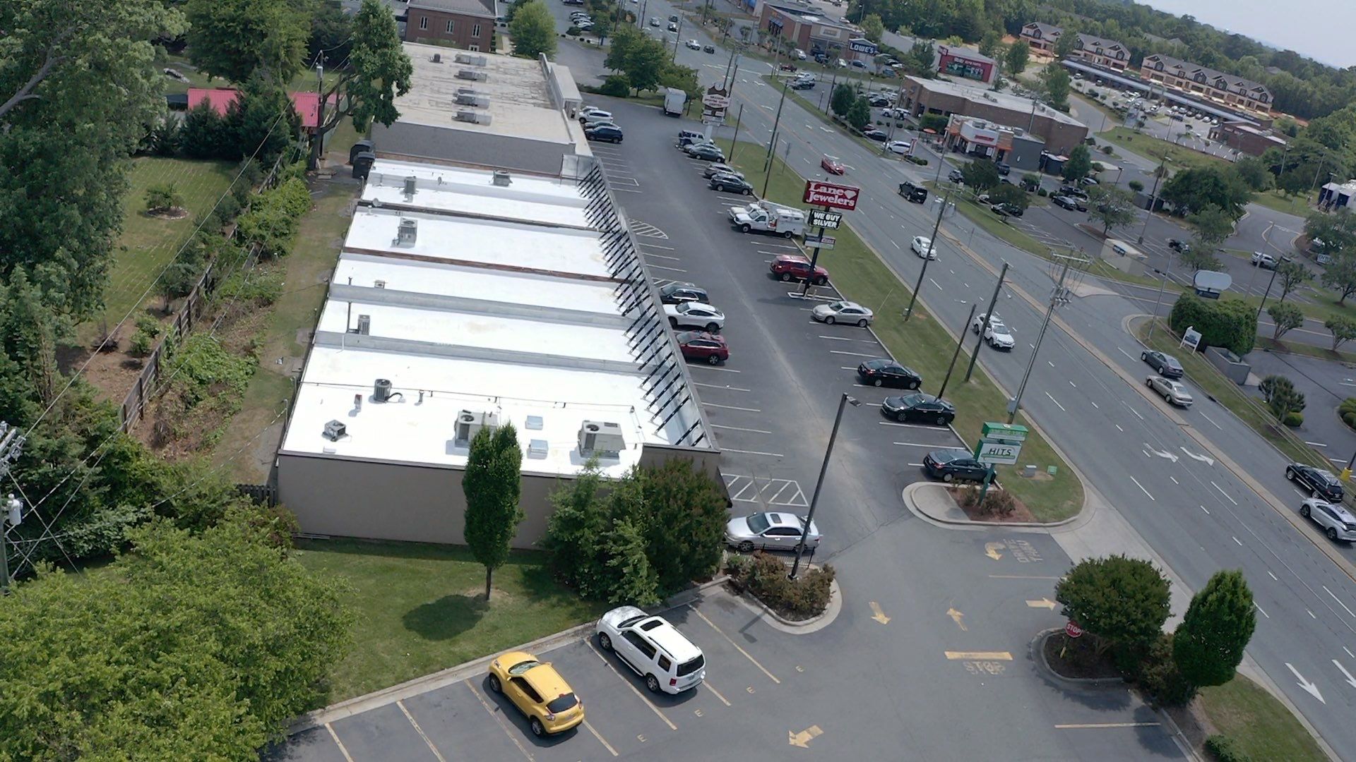 Commercial Roof Coating using Fiberseal basecoat and Silicon Topcoat by Just In Time Roofing and Restoration