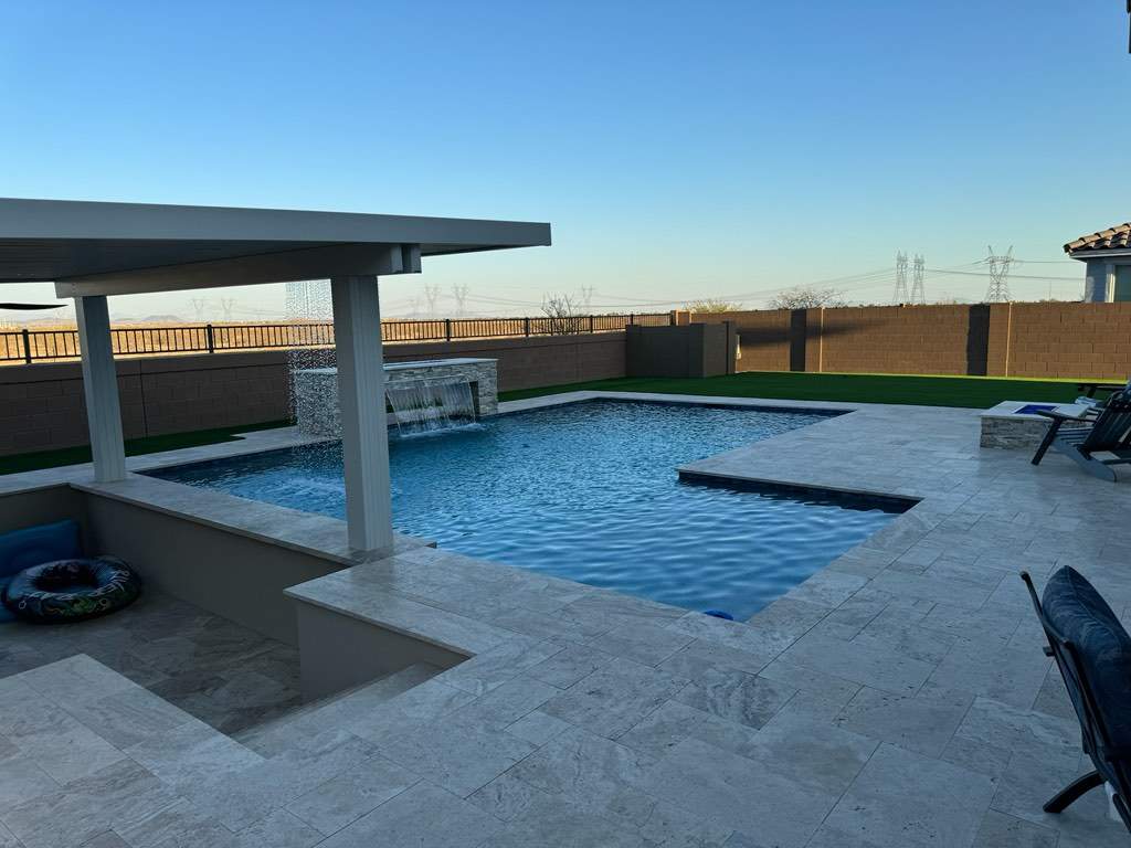 Pool build with custom water features & pergola by Modern Pools