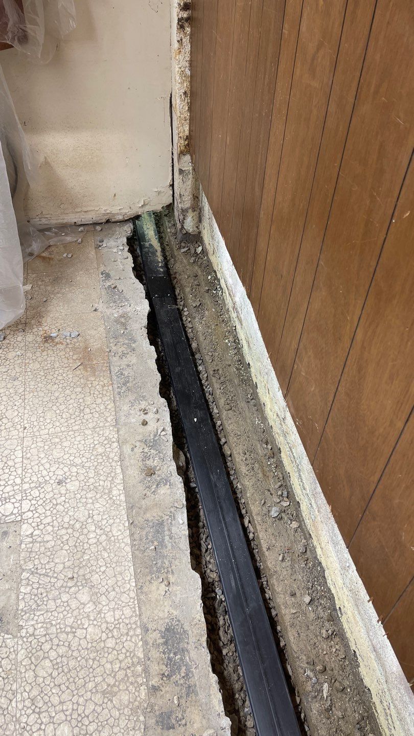 Interior Waterproofing Using GrateDrain™ Products by Toledo Basement Repair 