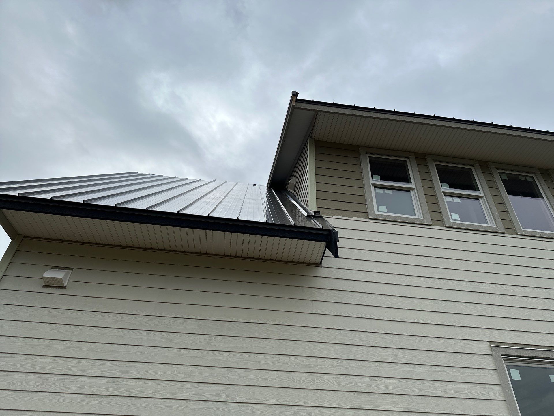 Residential Roofing Installation using 12" Prolok metal  by Top Notch Roofing Inc