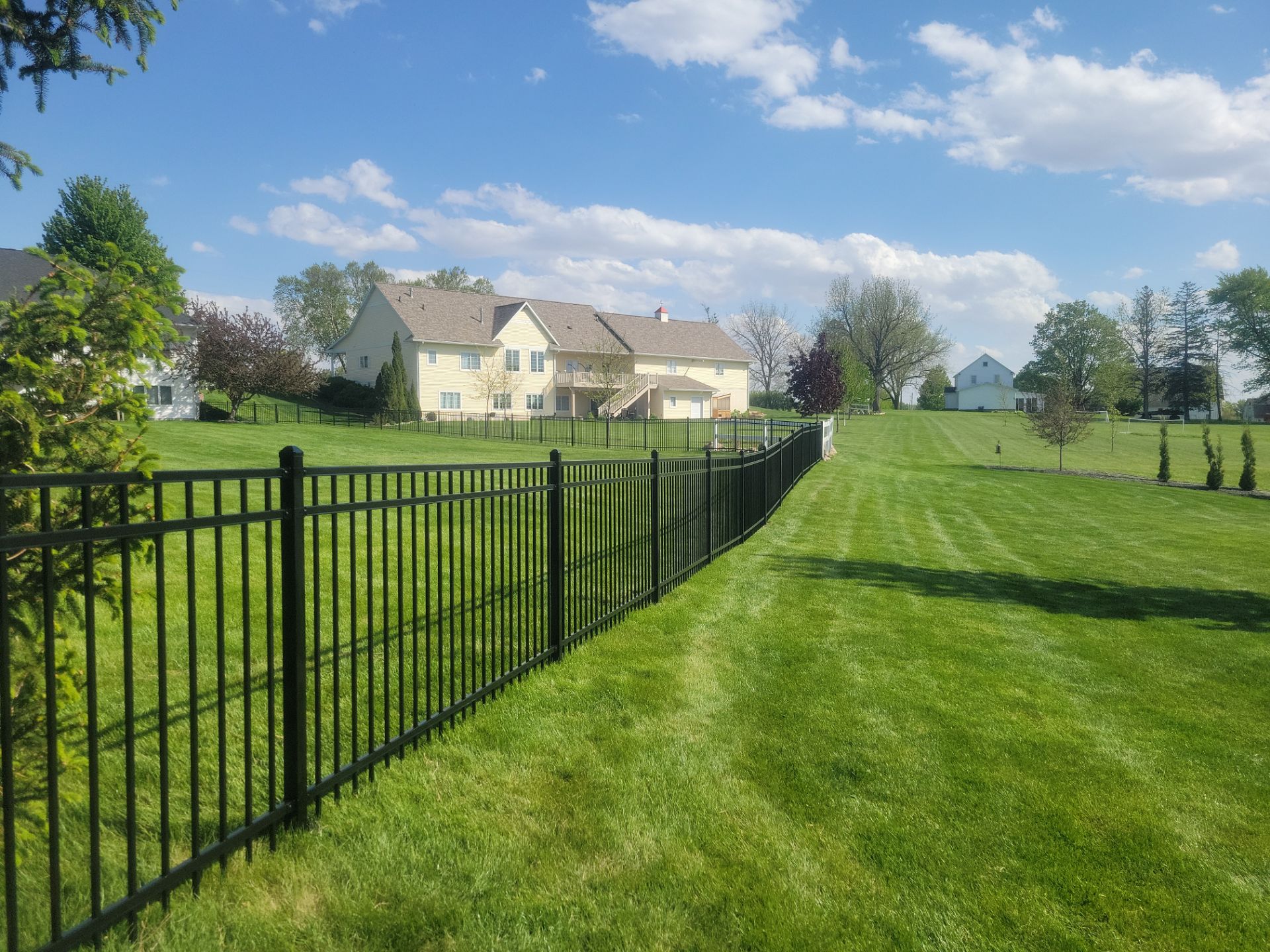 Black Ornamental Metal Picket Fence Installation in Waterloo by Perfect Picket Fence and Stain