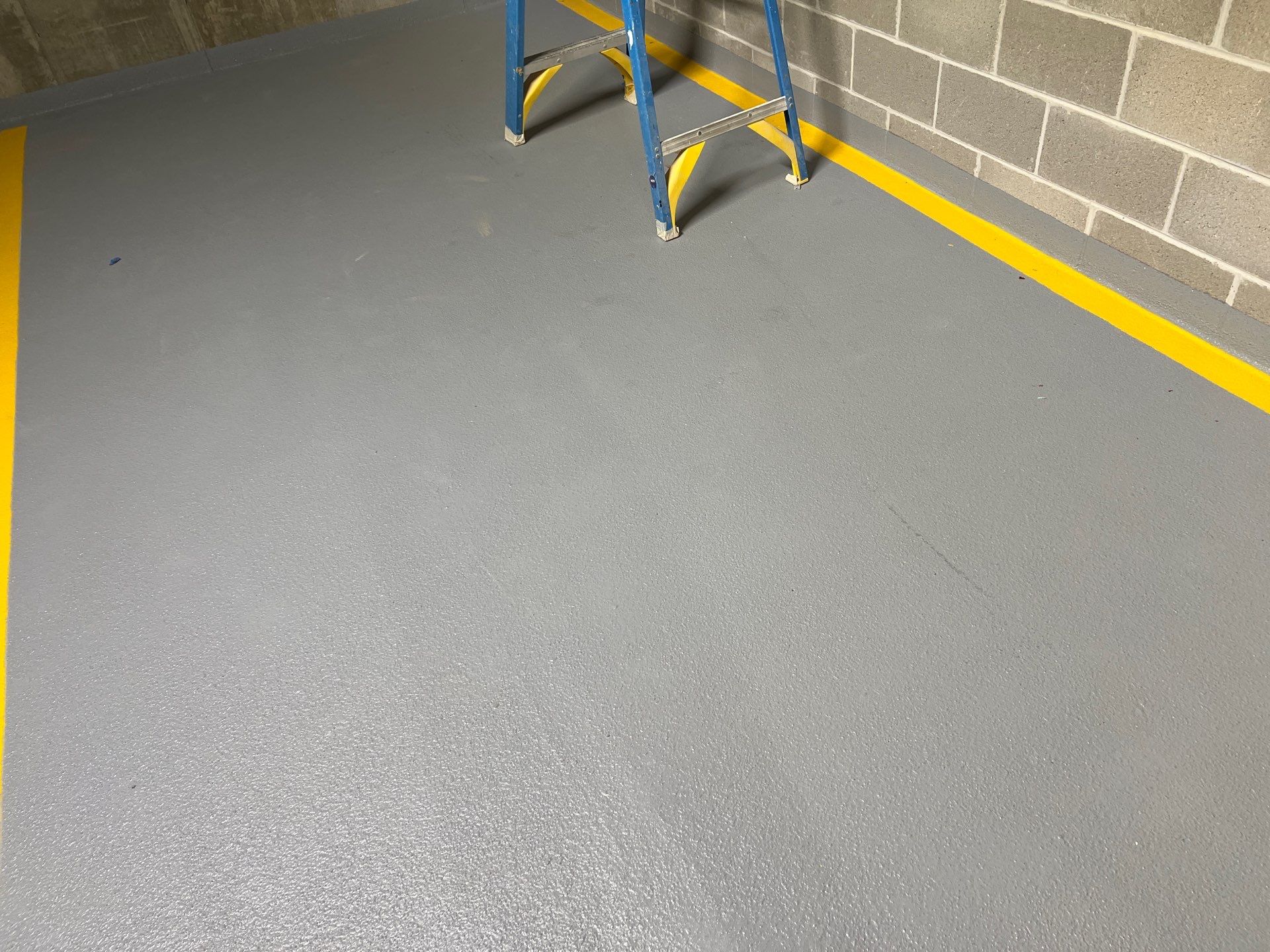 Parking garage using Hot water by Northern Power Washing LLC.