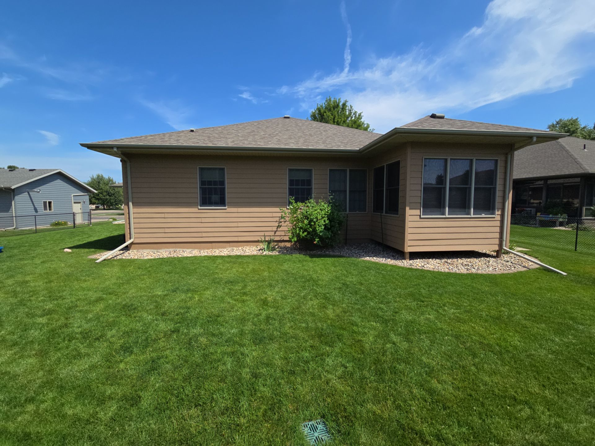 Sioux Falls Residential Exterior Door and Siding Refresh by Select Painting, Coatings & Garage Cabinets