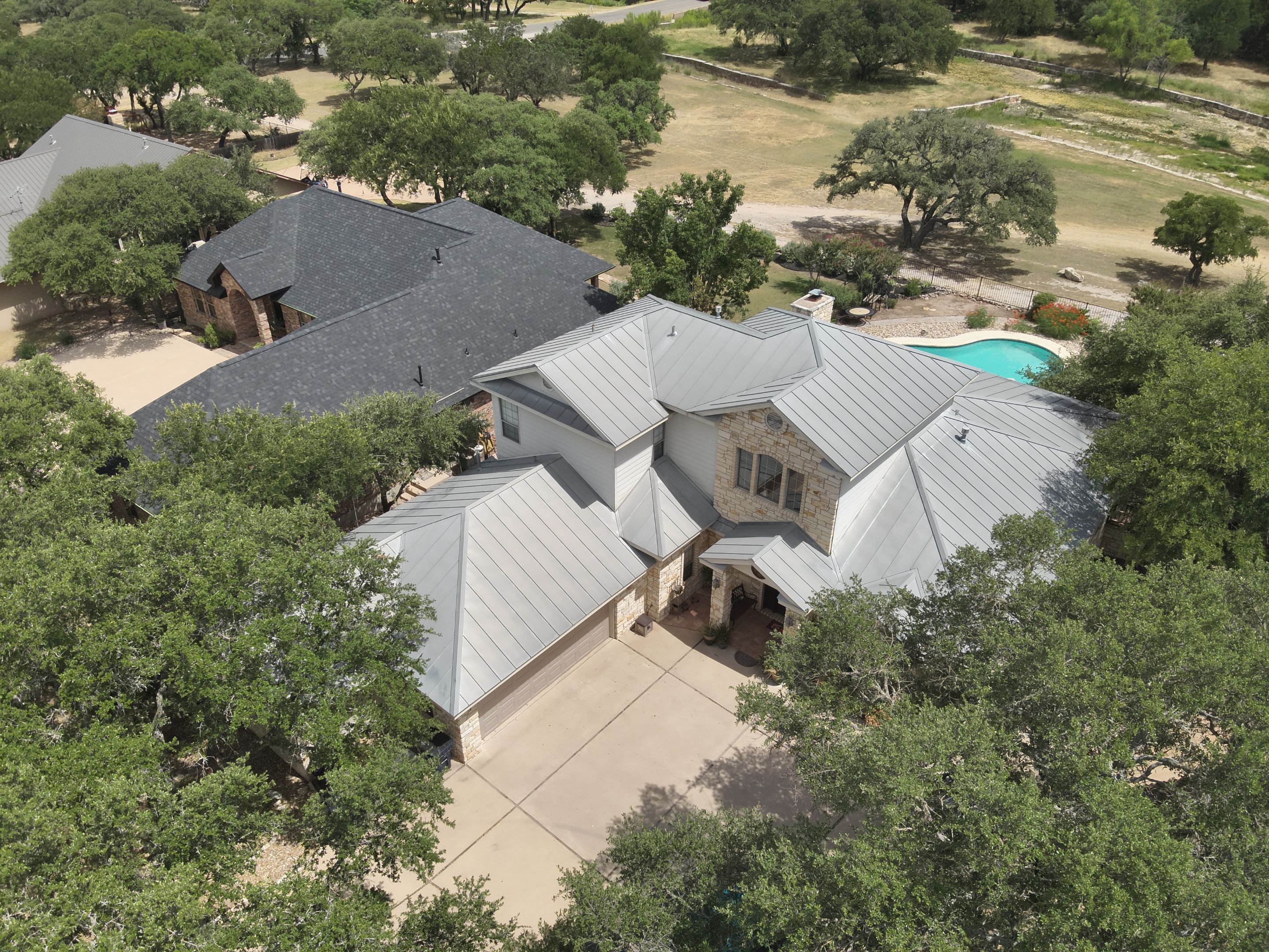 Residential Roof Replacement using 24 GA Double-Lock - Surrey Beige by Action Exteriors Austin