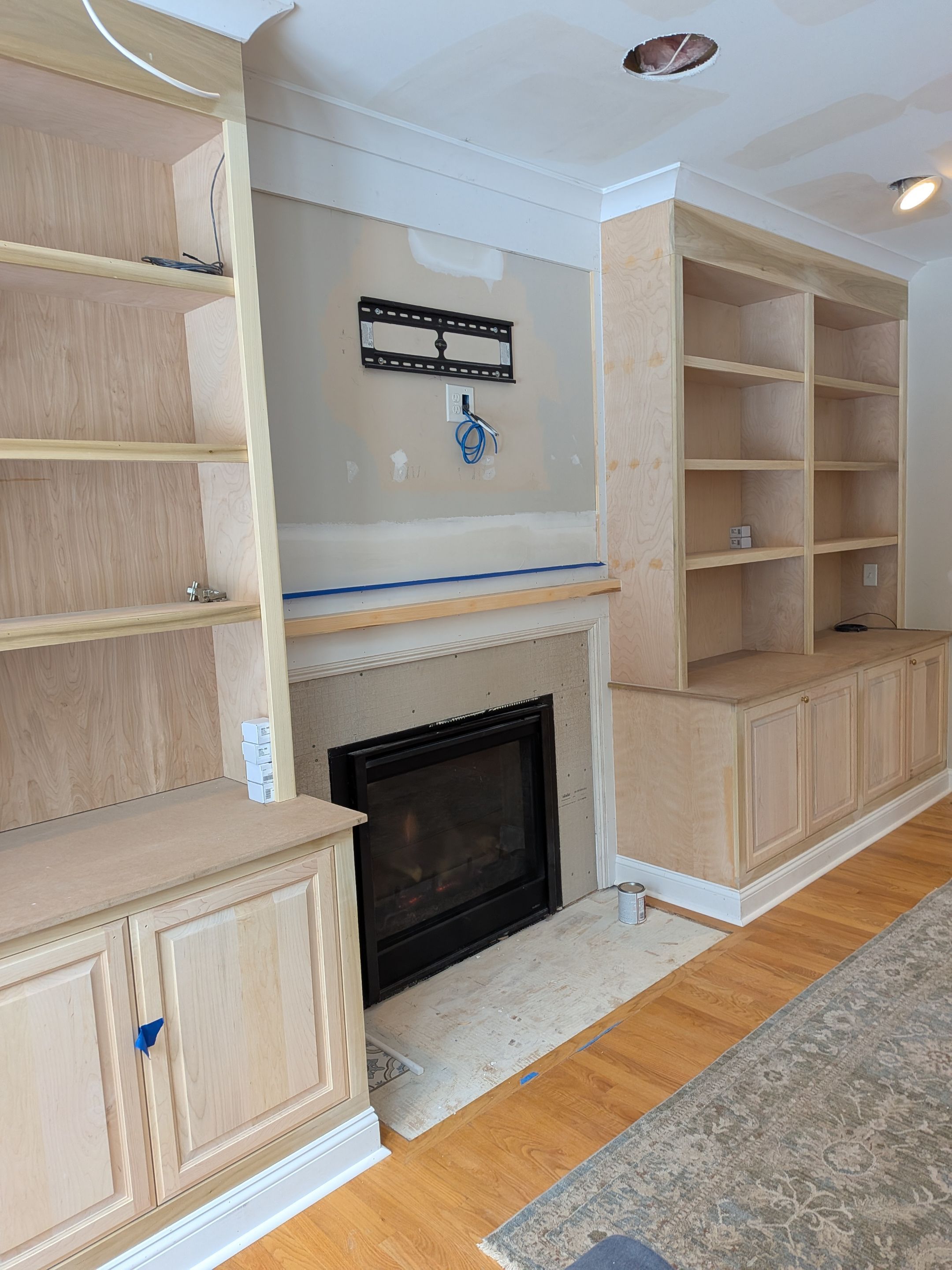 Custom Built-In Cabinetry with Bookshelves by Dennis Moffitt Painting