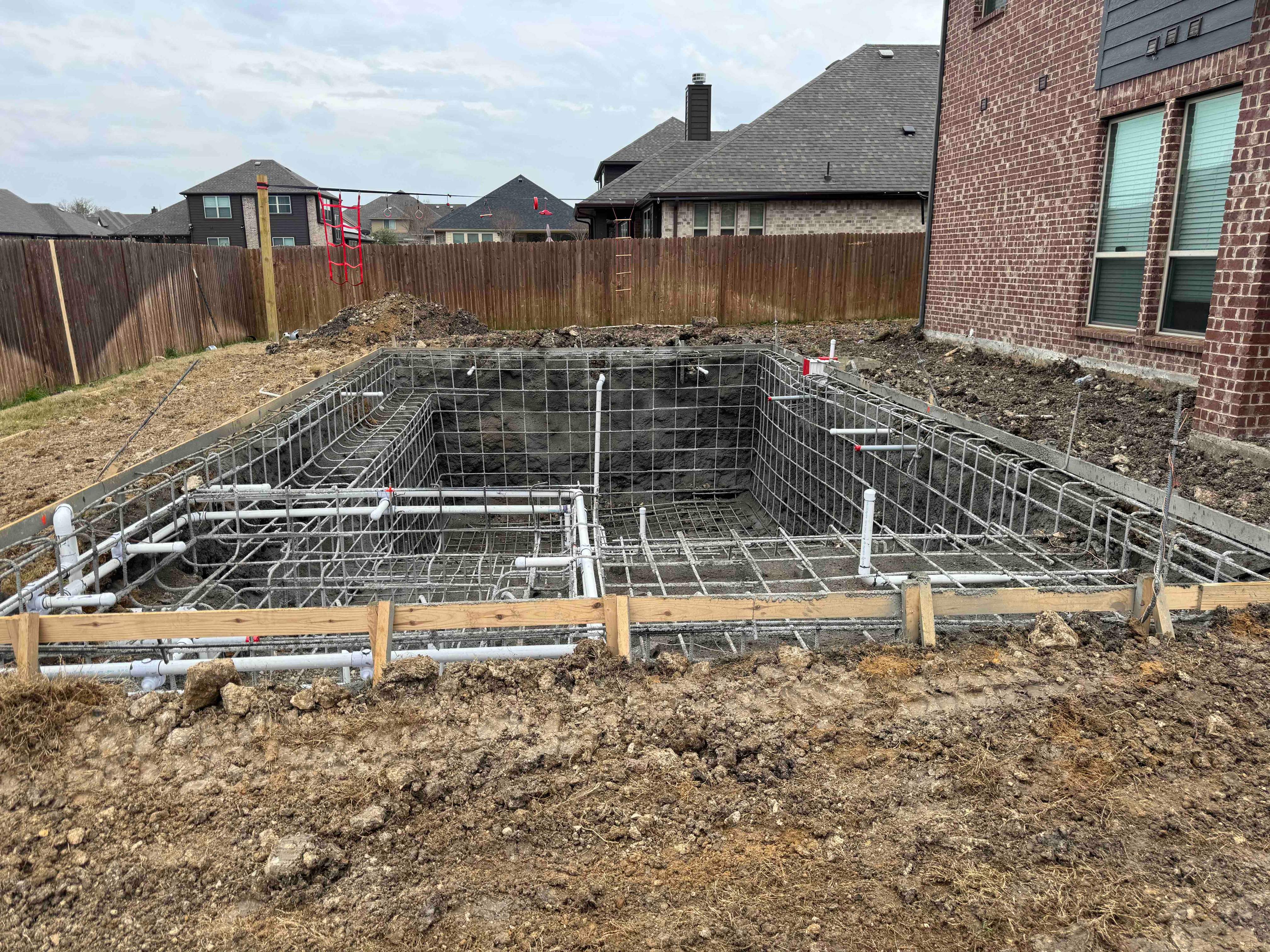 Geometric Pool with Tanning Ledge by Pinnacle Pools and Spas - DFW