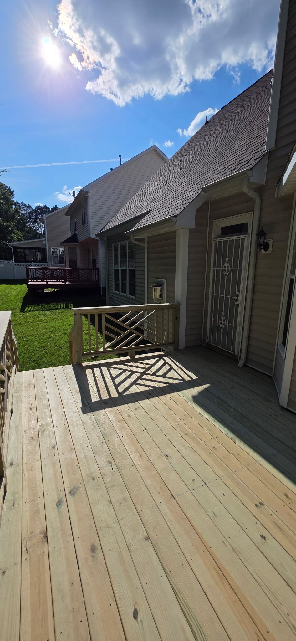 Raleigh Wooden Deck Resurfacing and Decorative Lattice Railing Upgrade by The Remodeling Company