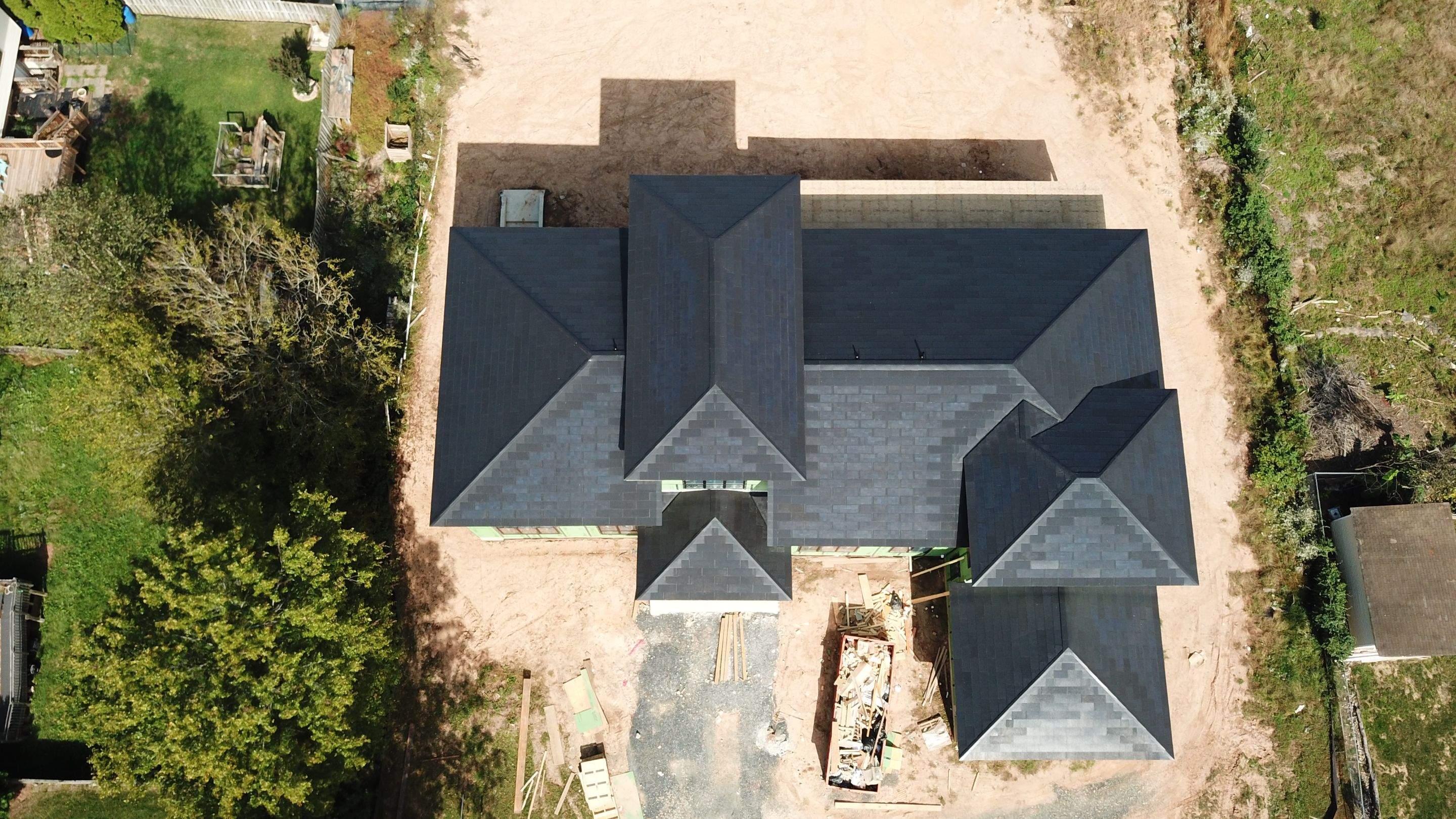 Tesla Solar Roof  using Tesla Solar Roof V3 tiles by American Home Contractors