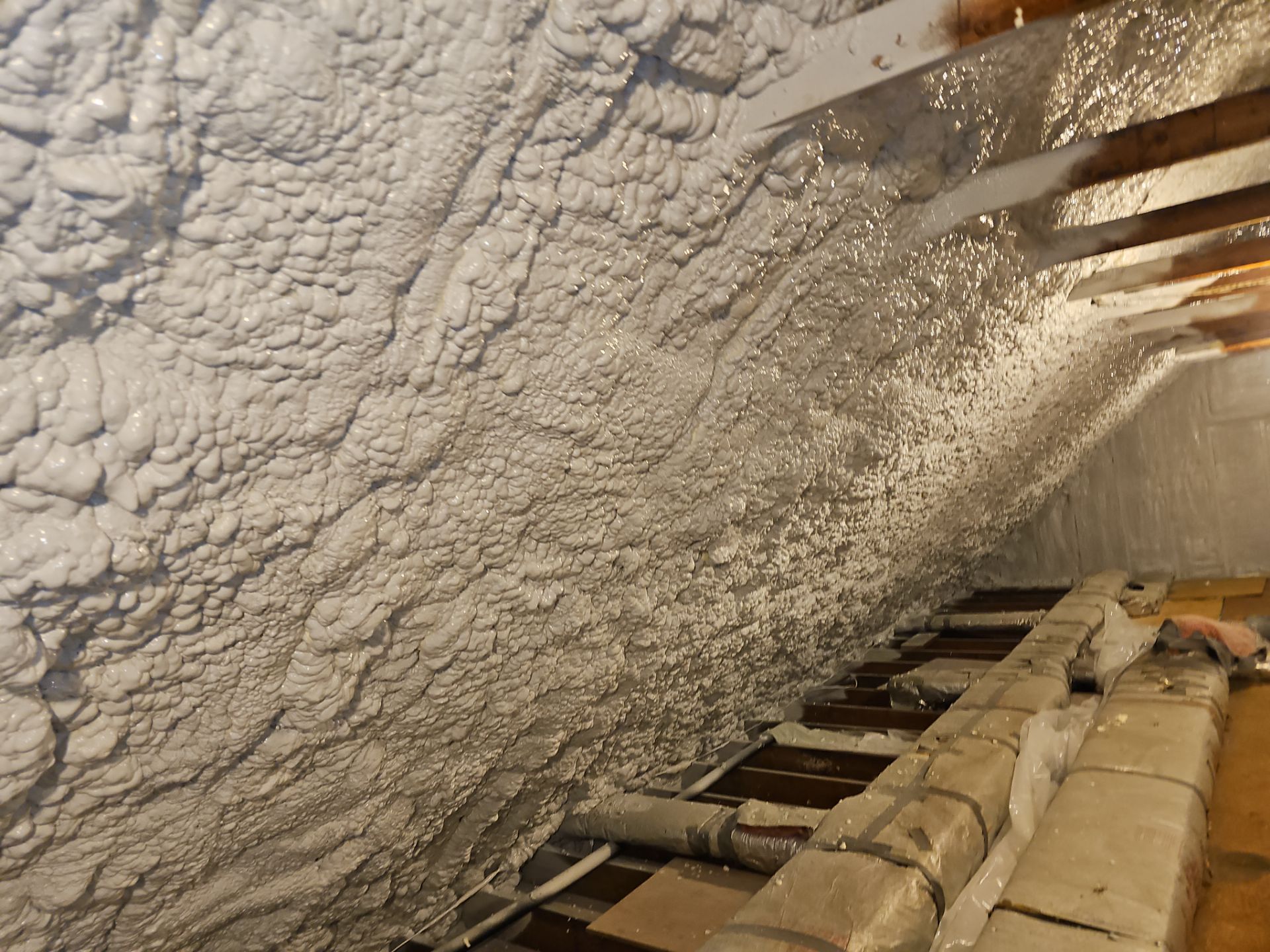 Attic Retrofit using open cell spray foam by NYS Foam & Energy