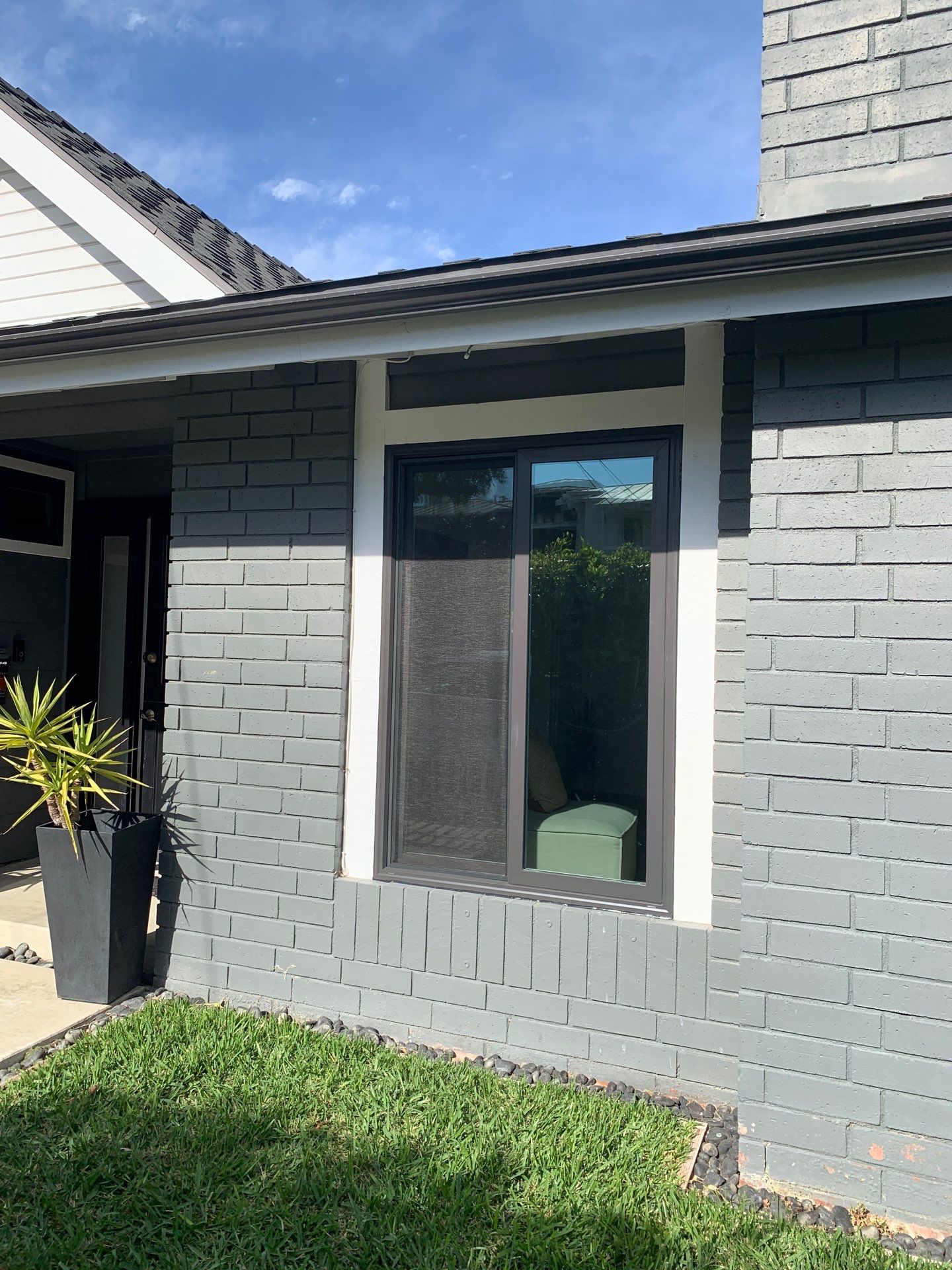 Window Installation using Milgard black vinyl windows by American Window Company