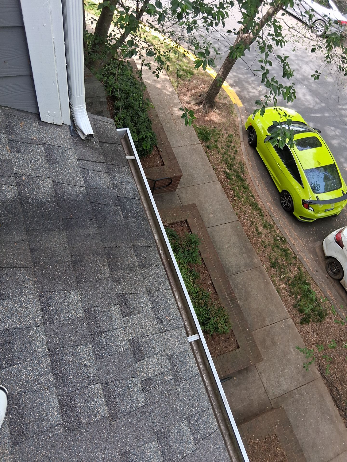HOA gutter cleaning in Huntersville, NC, after  photo showing full gutters.