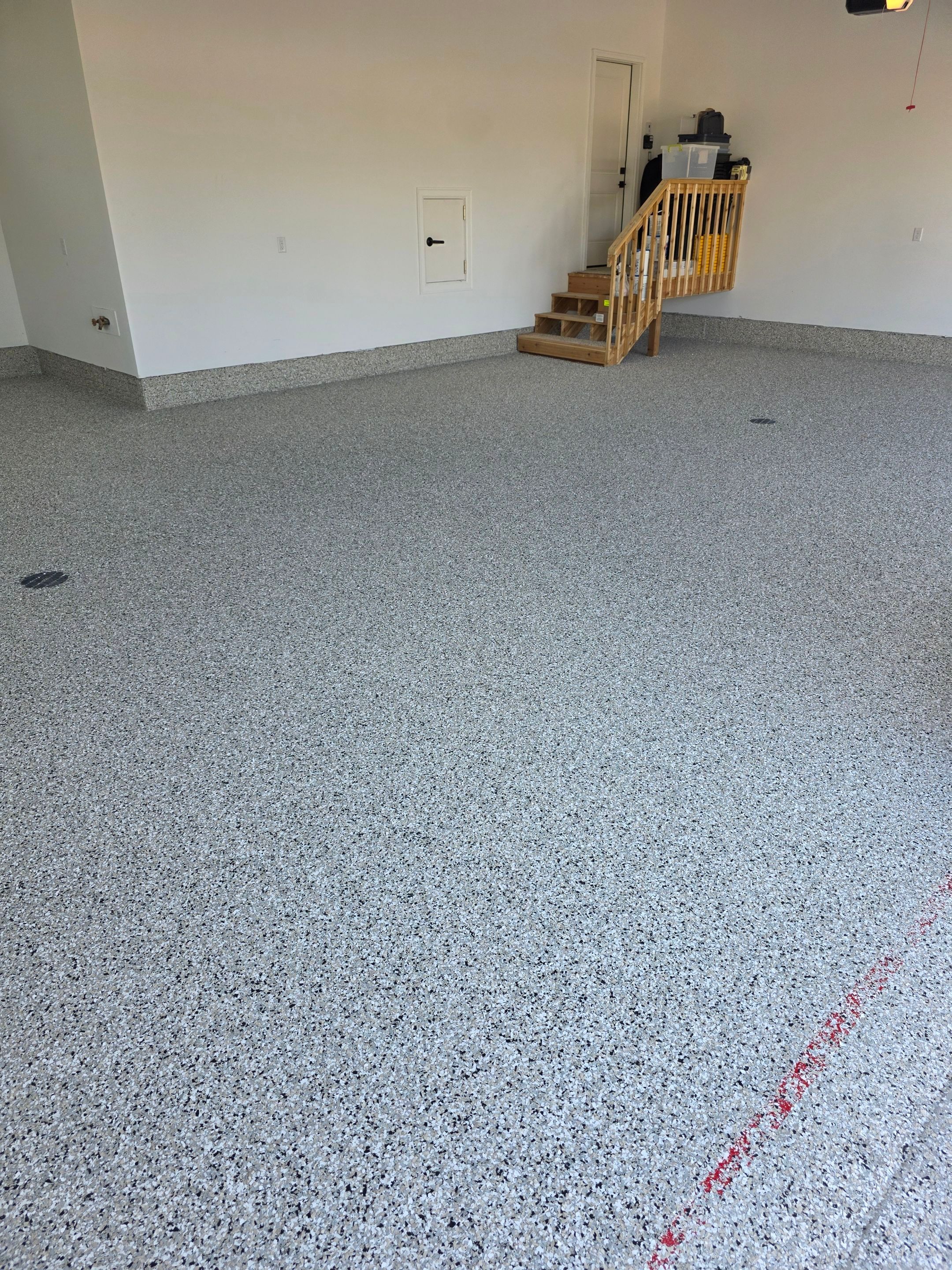 Gray and Black Speckled Polyurea Garage Floor in Dell Rapids by Select Painting, Coatings & Garage Cabinets