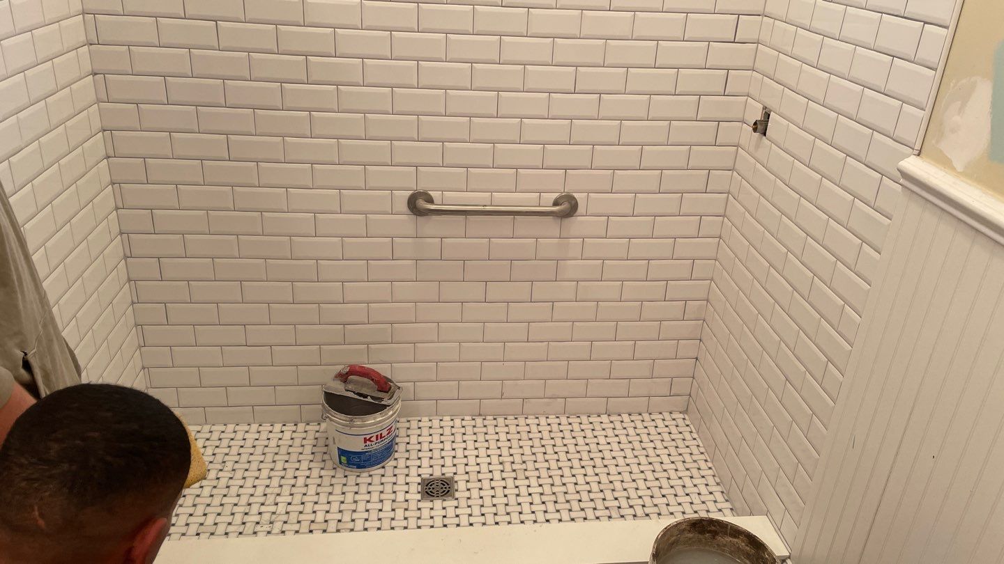 Shower Transition Highlighting Stained Glass Window by Footprints Floors of Coastal Carolina