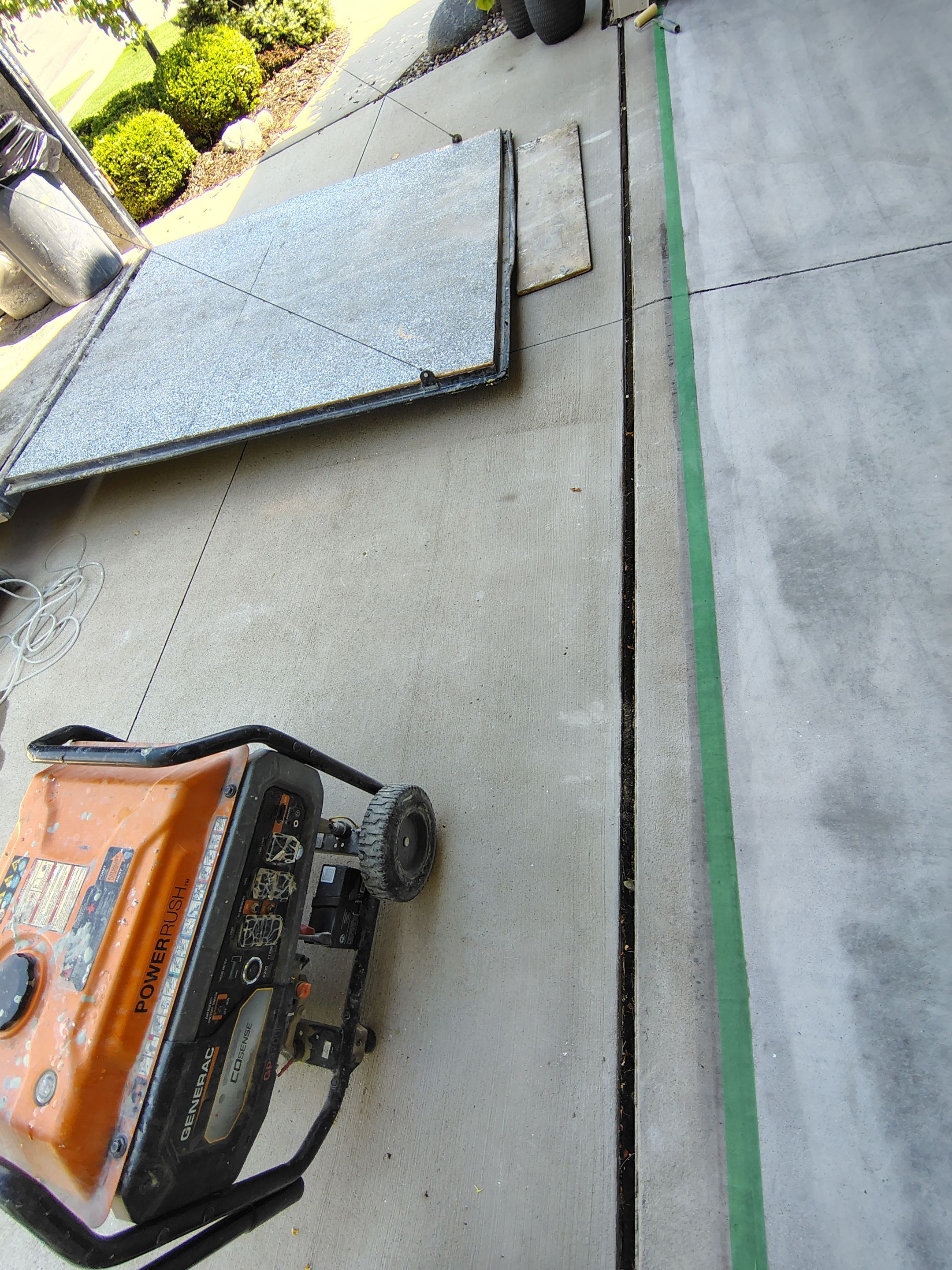 Coyote Garage Floor Coating in Sioux Falls by Select Painting, Coatings & Garage Cabinets
