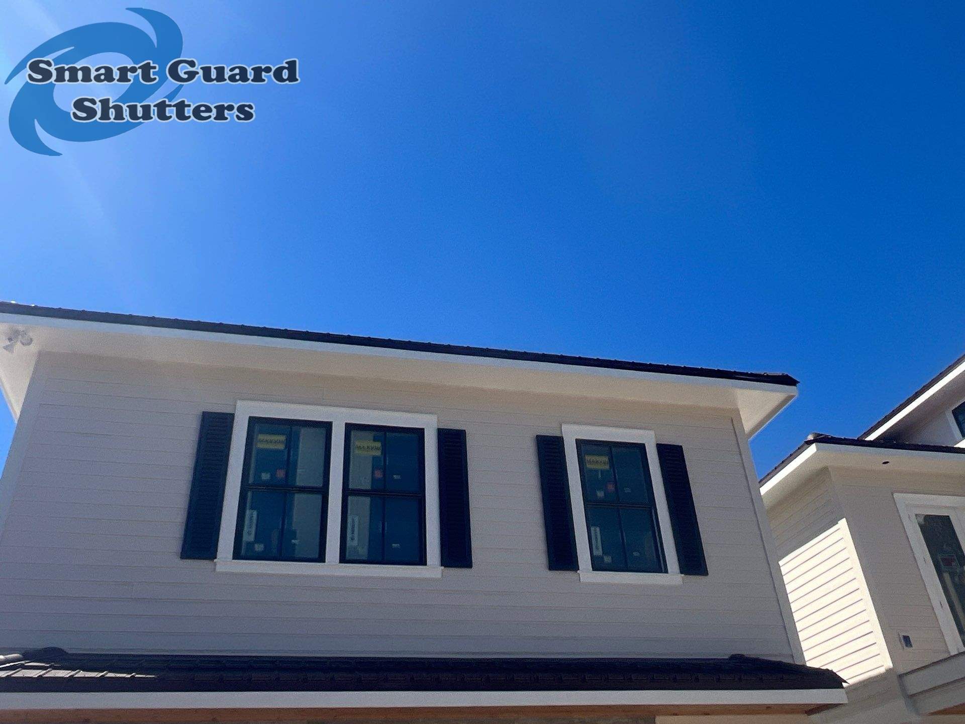 Decorative Colonial Shutters in Grey Brown by Smart Guard Shutters