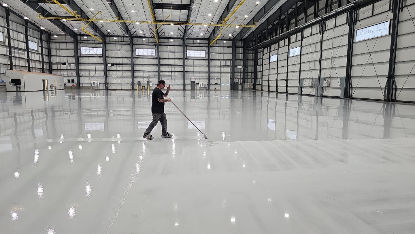 Airplane Hanger using Light Grey Commercial Penntek Epoxy by Croc Coatings, LLC