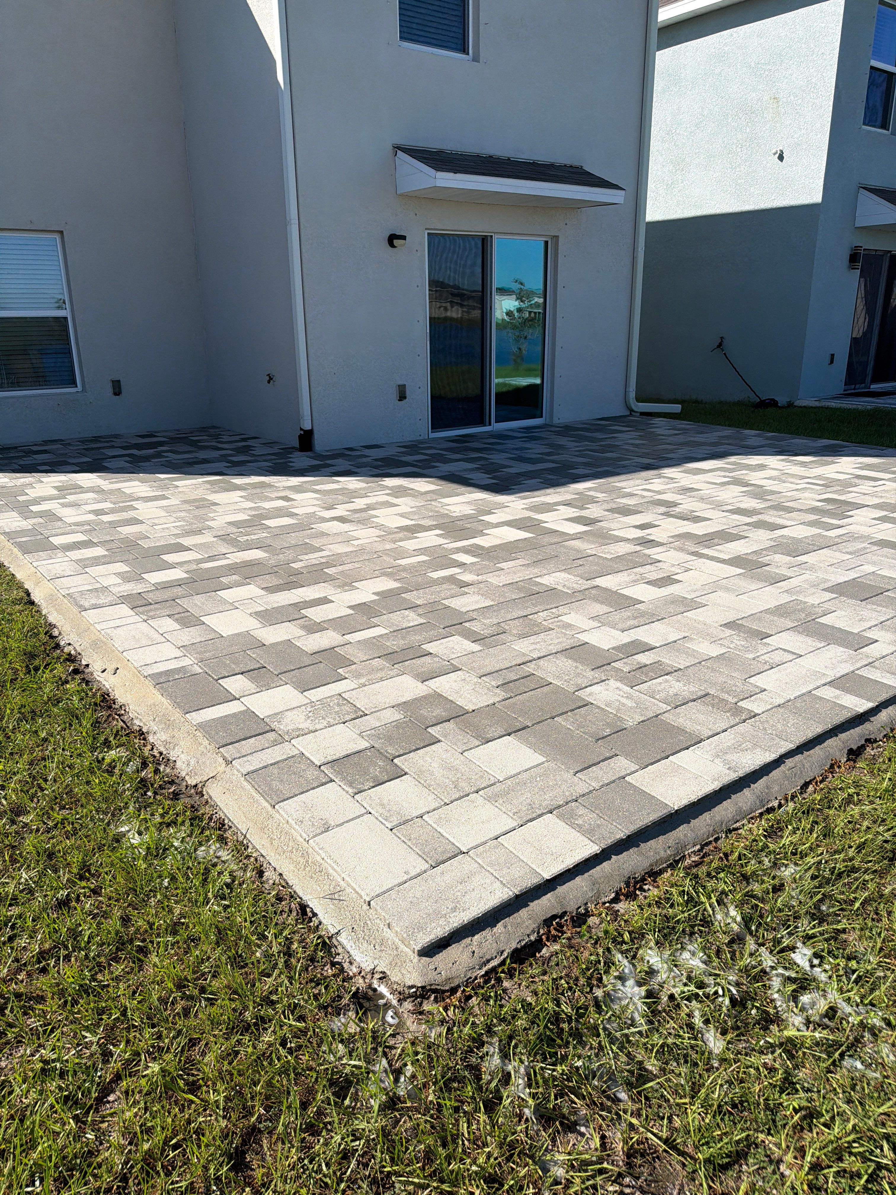 Paver Sealing and Restoration for Large Multi-Toned Patio in Wimauma by Supreme Paver Experts