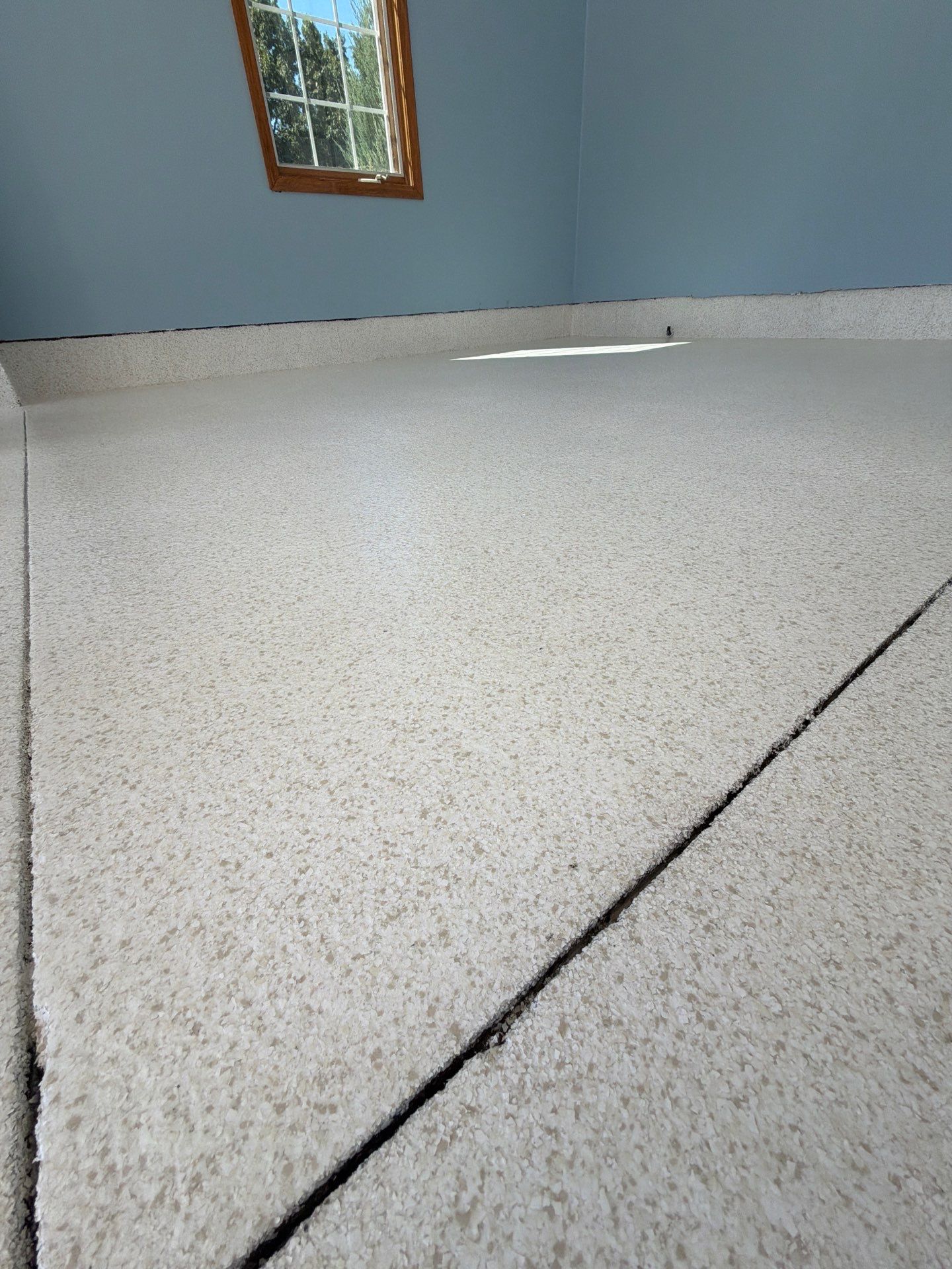Custom Epoxy Flake Garage Floor Installation in Norton Shores by Gordon Painting