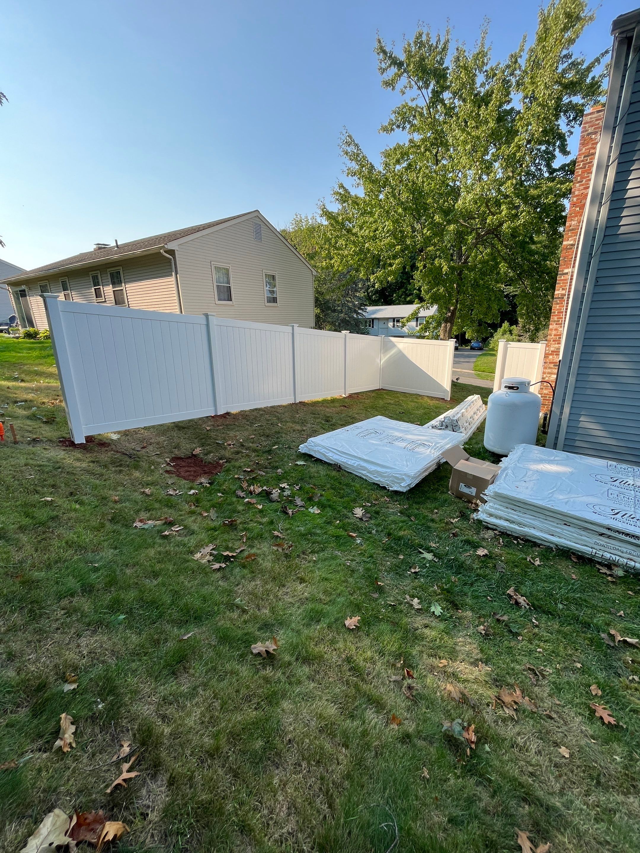 New Vinyl Privacy fence in White with matching gate by DiGiorgi Roofing and Siding Inc