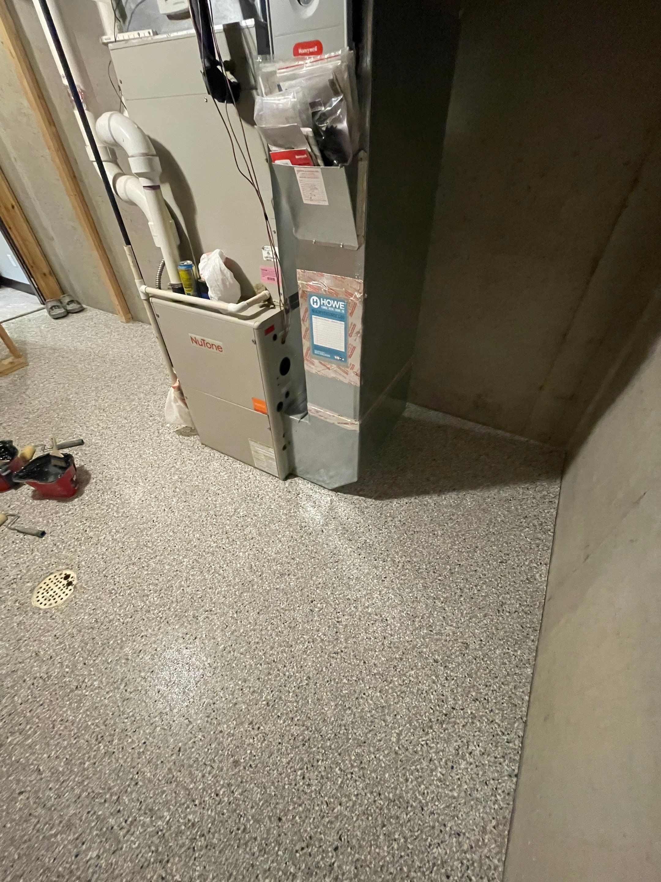 Sioux Falls Basement Floor Transformation with Durable Epoxy Flake Coating by Select Painting, Coatings & Garage Cabinets