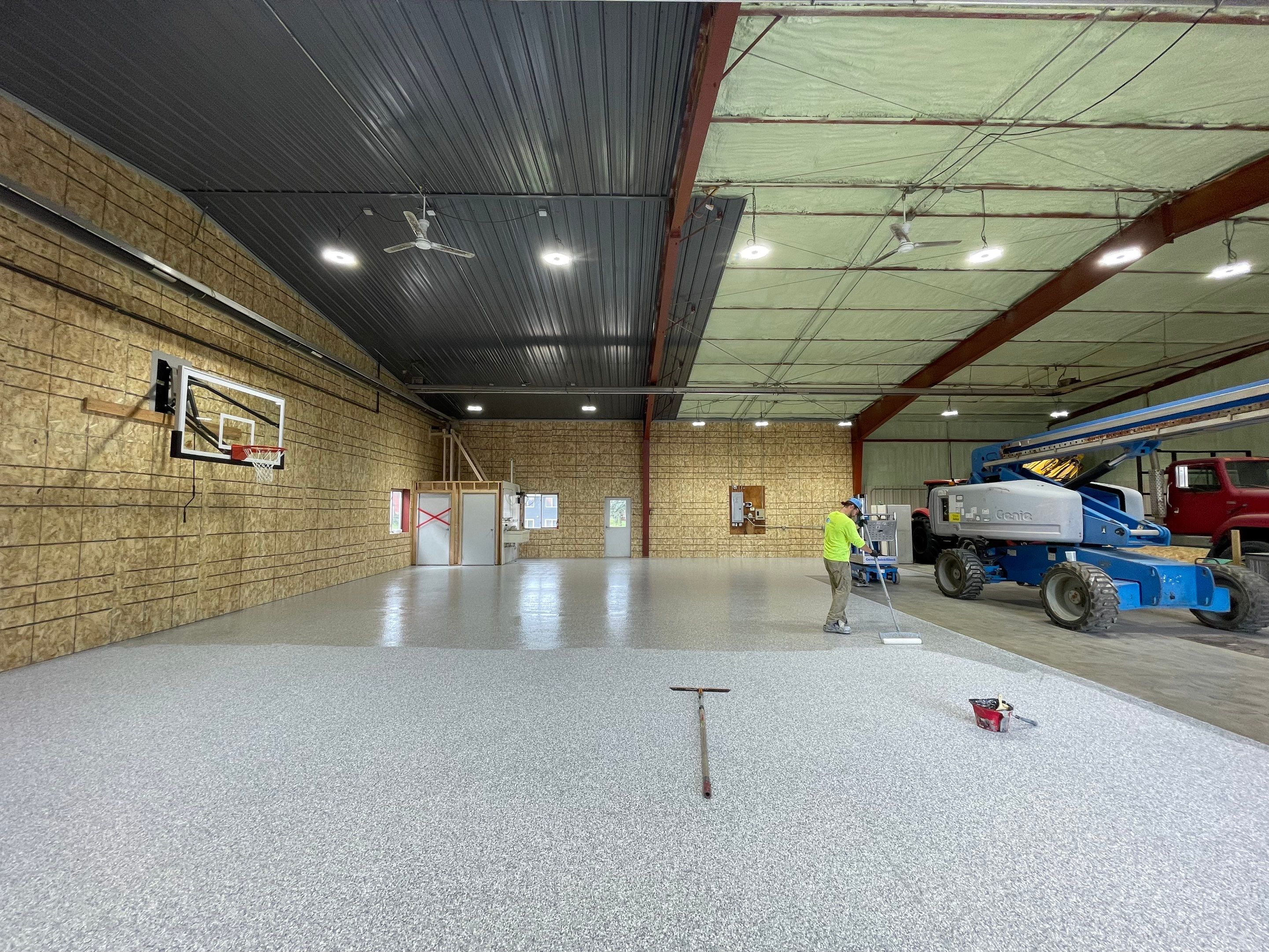 Custom Polyurea Shop Floor with Basketball Court Lines in Rock Valley by Select Painting, Coatings & Garage Cabinets