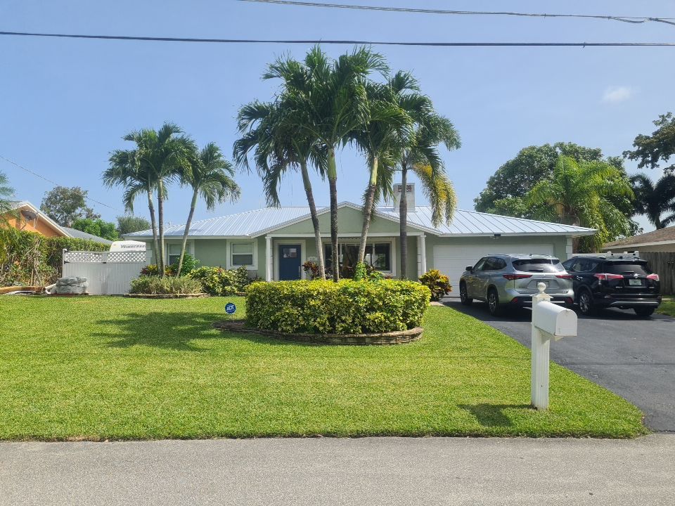 Residential Roofing Installation using 1" Nail strip metal roof by BLUES BROTHERS CONSTRUCTION CORP