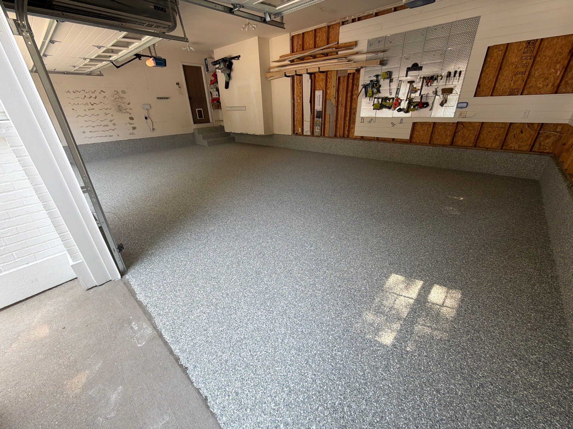 Custom Grey Flake Epoxy Garage Floor and Step Coating in Norton Shores by Gordon Painting