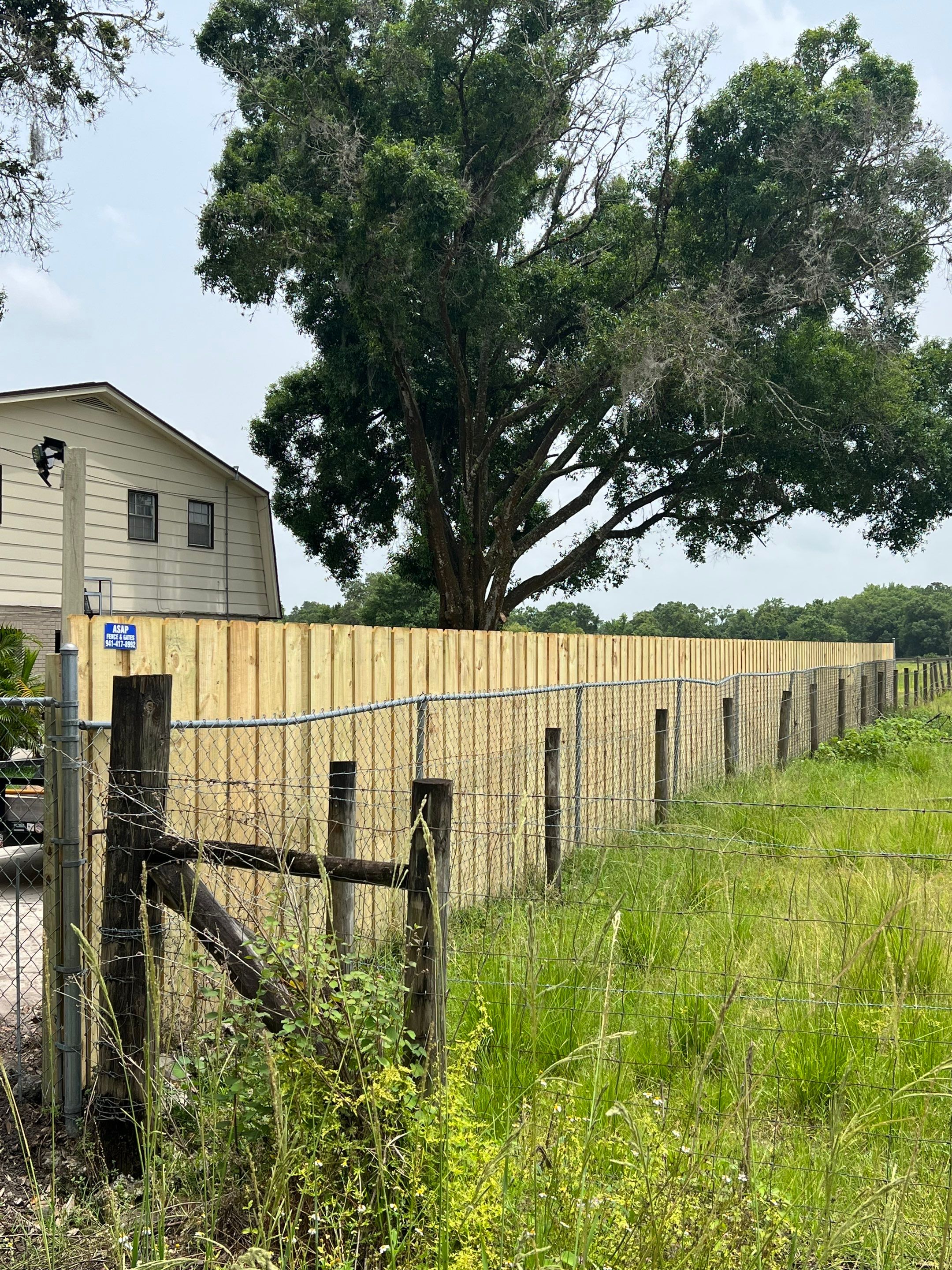 Dover, FL 6ft. Treated Board on Board Privacy Fence  by Asap fence and gates, LLC
