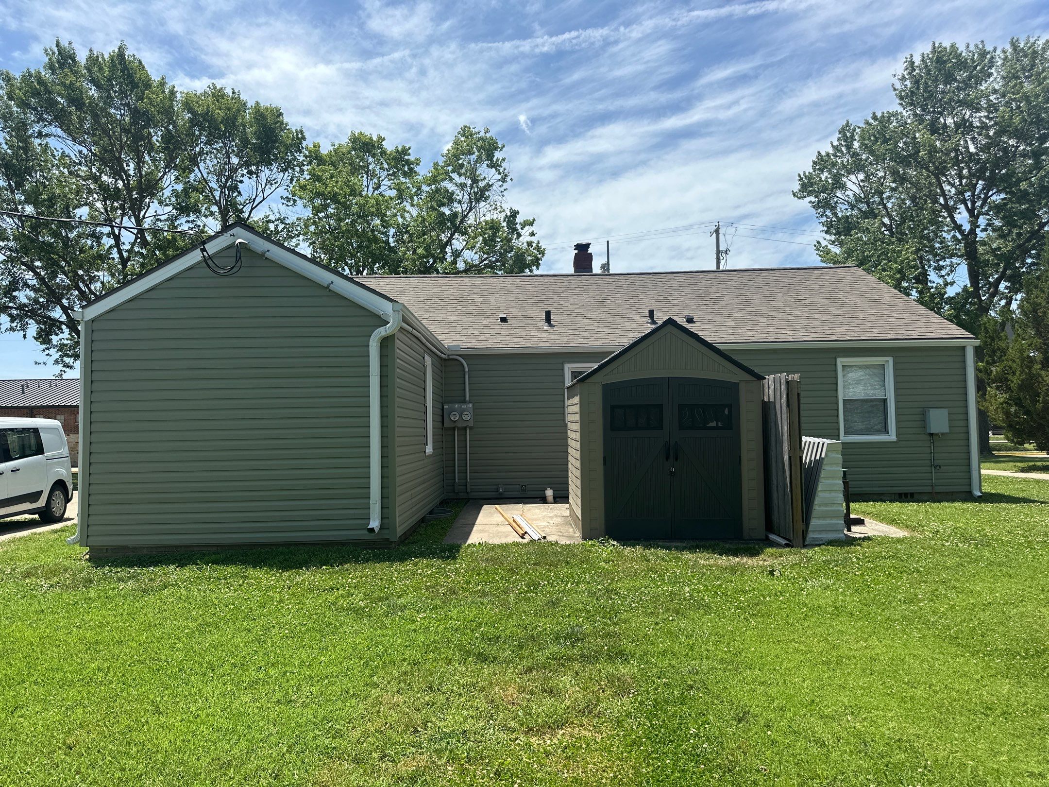 New Cypress Siding going on this North Kansas City Home  by EEC  Windows, Siding & Roofing 