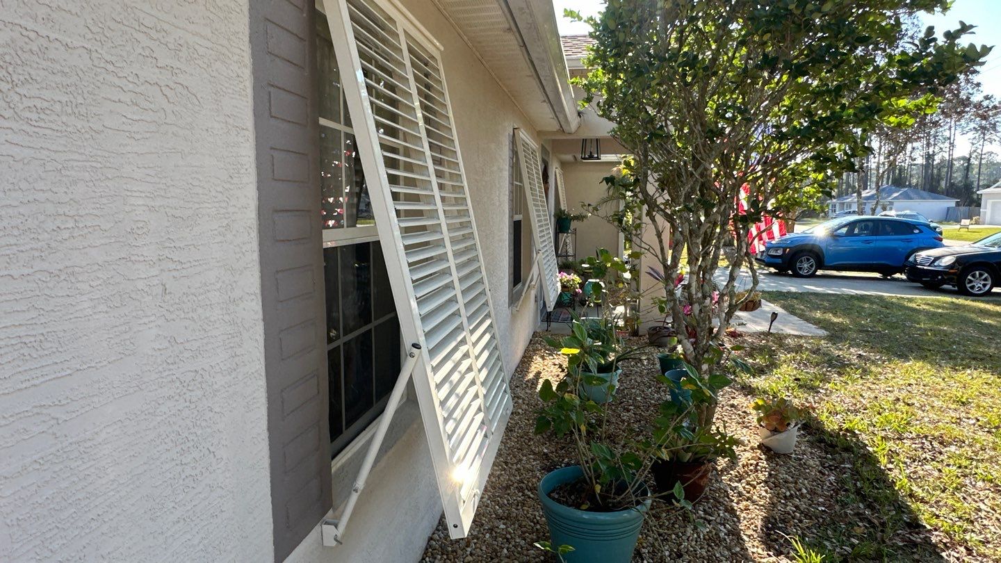 Hurricane Rated Bahama Shutters in Cream by Smart Guard Shutters