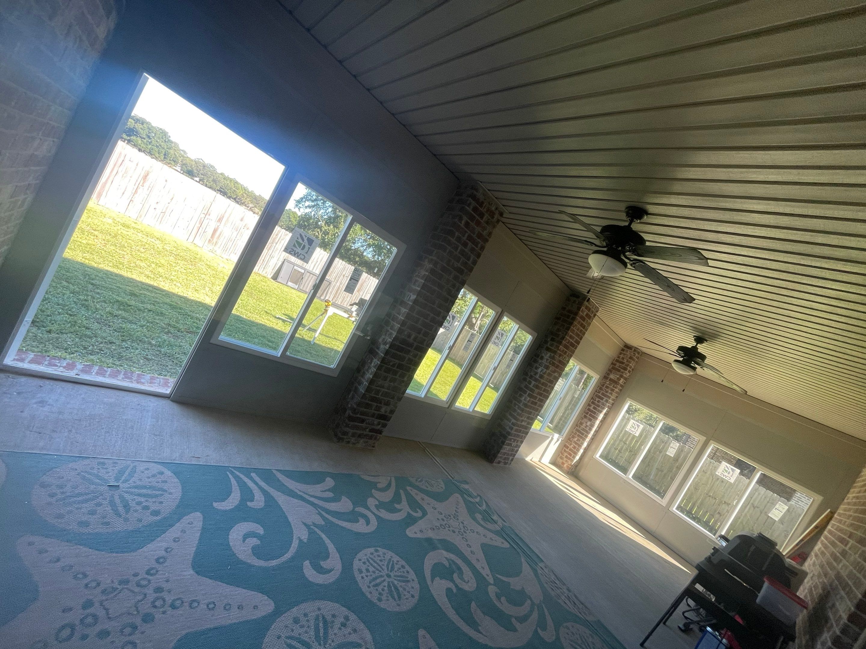 Glass Room Under Existing Patio Cover by Titan Sunrooms