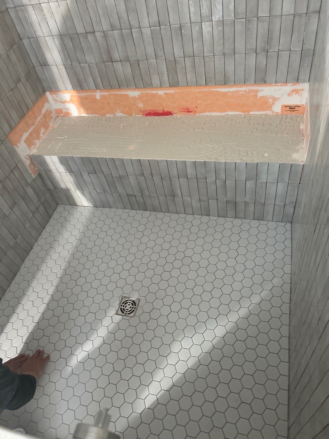 Tile floors, walls, showers, and accent wall for bathrooms  by Footprints Floors of Nashville