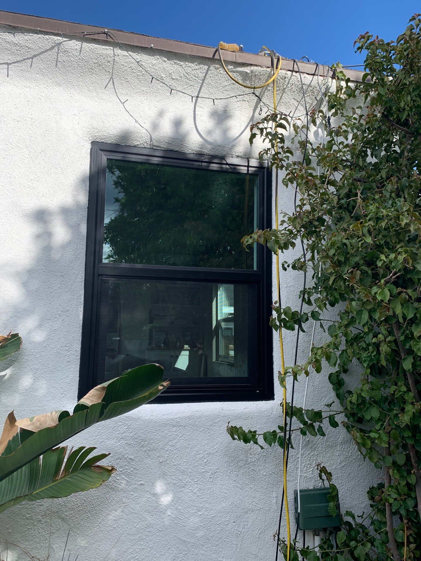 Window Installation using Black Anlin windows by American Window Company