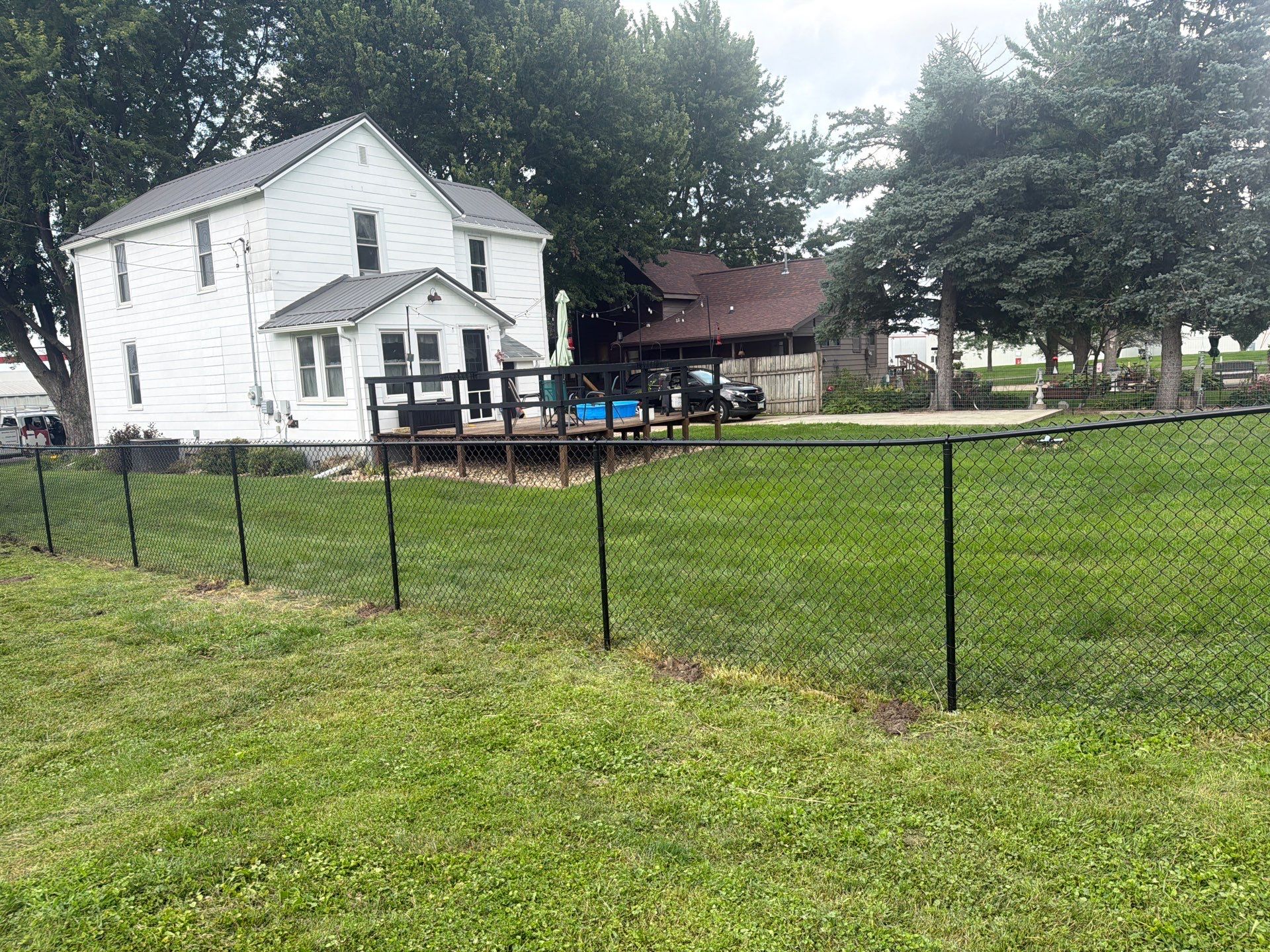 Residential Black Chain Link Fence Installation in Reinbeck by Perfect Picket Fence and Stain