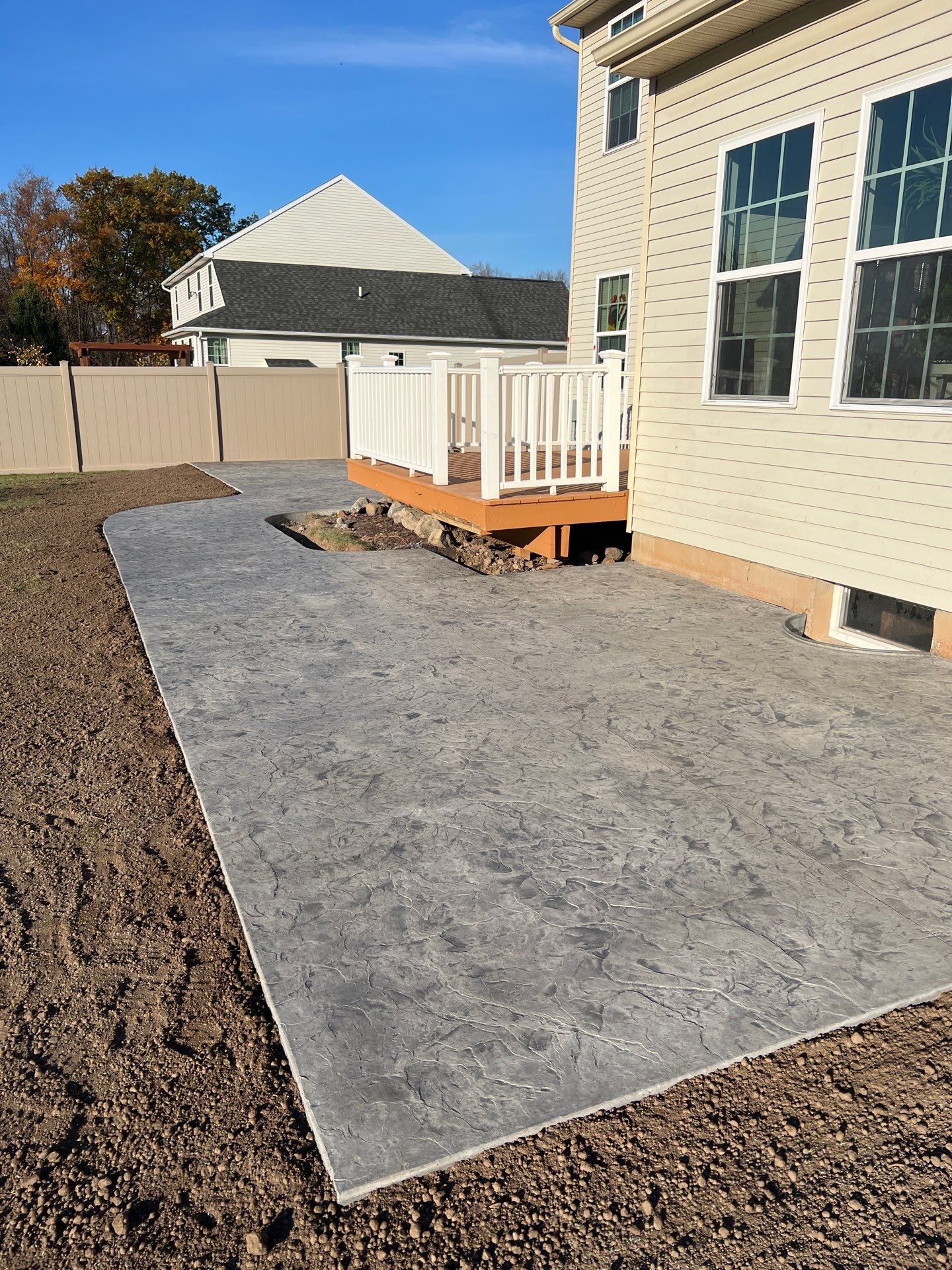 Oxford Slate stamped concrete patio  by NG Masonry & Construction LLC