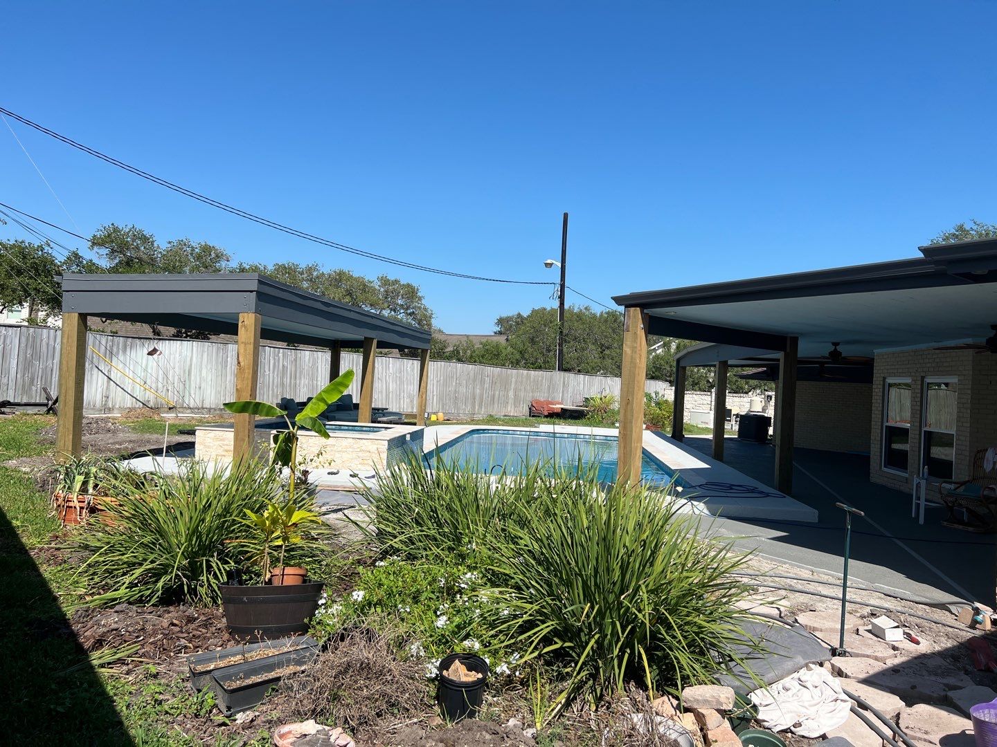 Beautiful pool side build by Bayfront Roofing and Construction