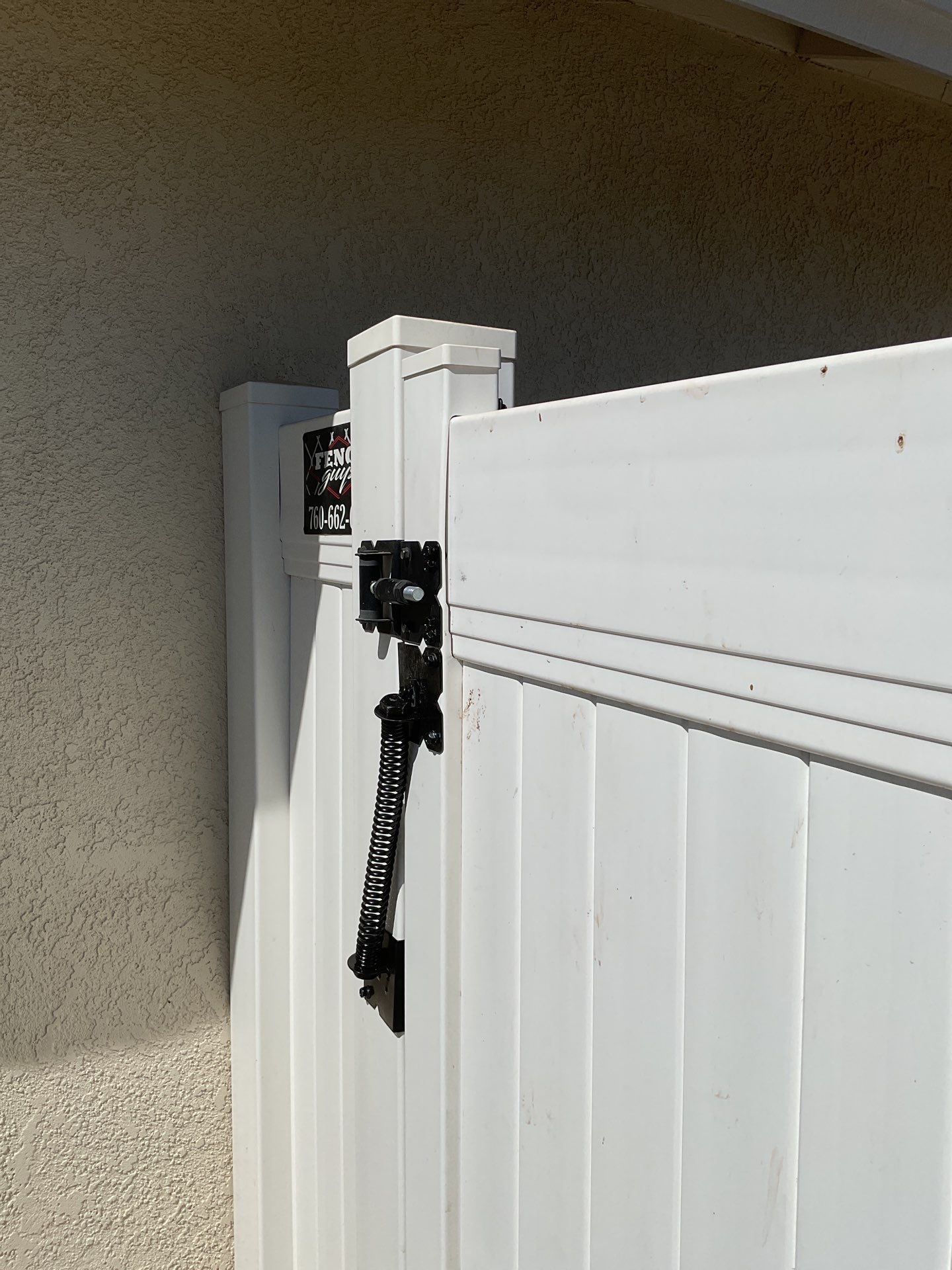 Gate installation using Vinyl by Fence Guys Inc. 