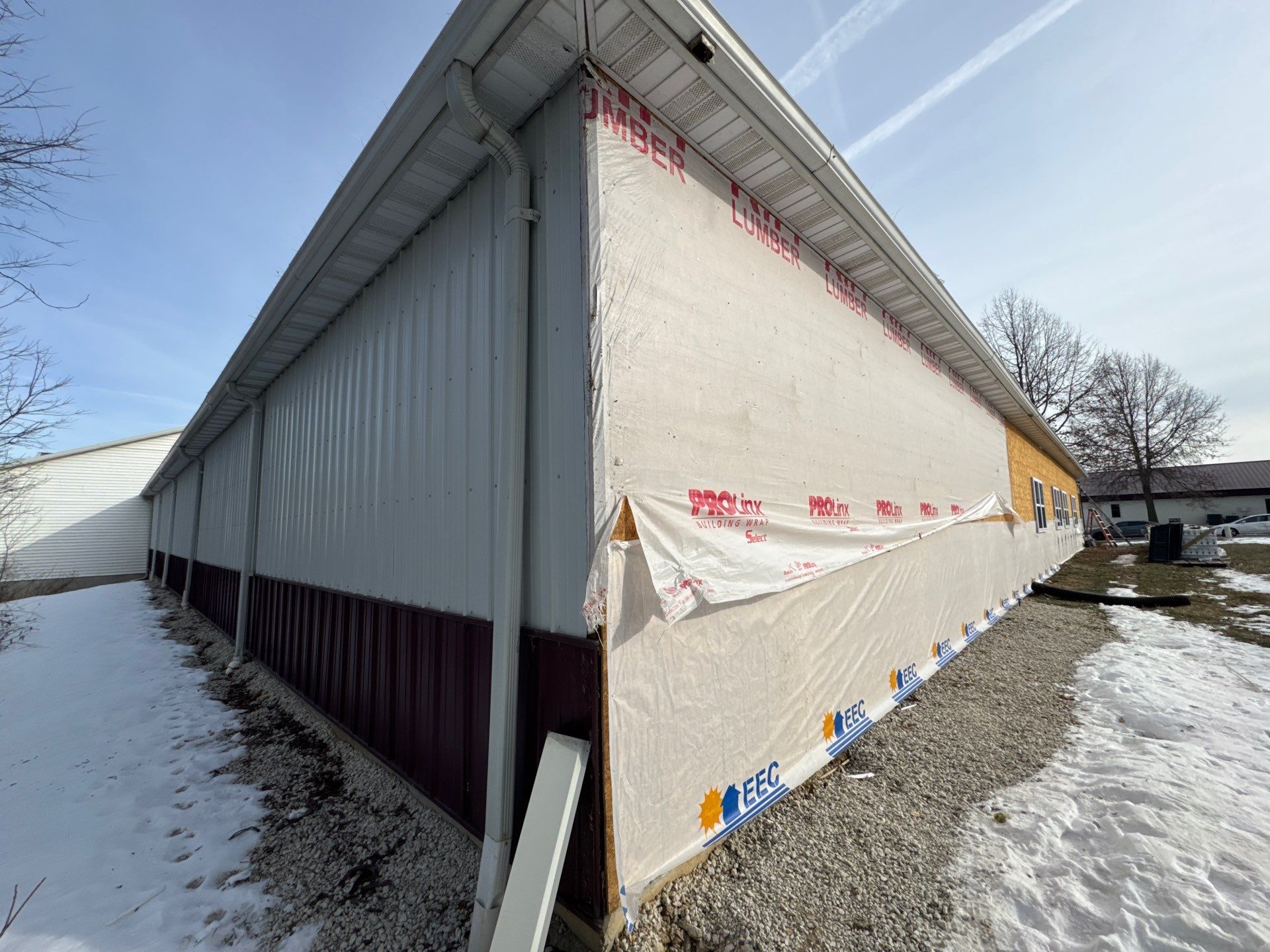 Siding and Stone Installation using Extrerior Porfolio Vinyl Siding and Versetta Stone by EEC  Windows, Siding & Roofing 