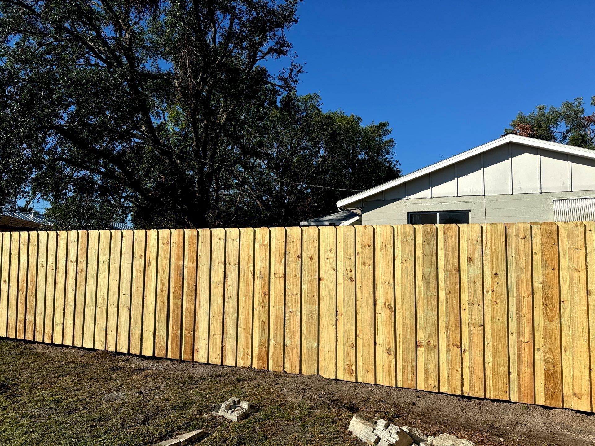 Wood Fence Installation using 6Ft Pressure Treated Wood Board On Board Privacy Fence by Asap fence and gates, LLC