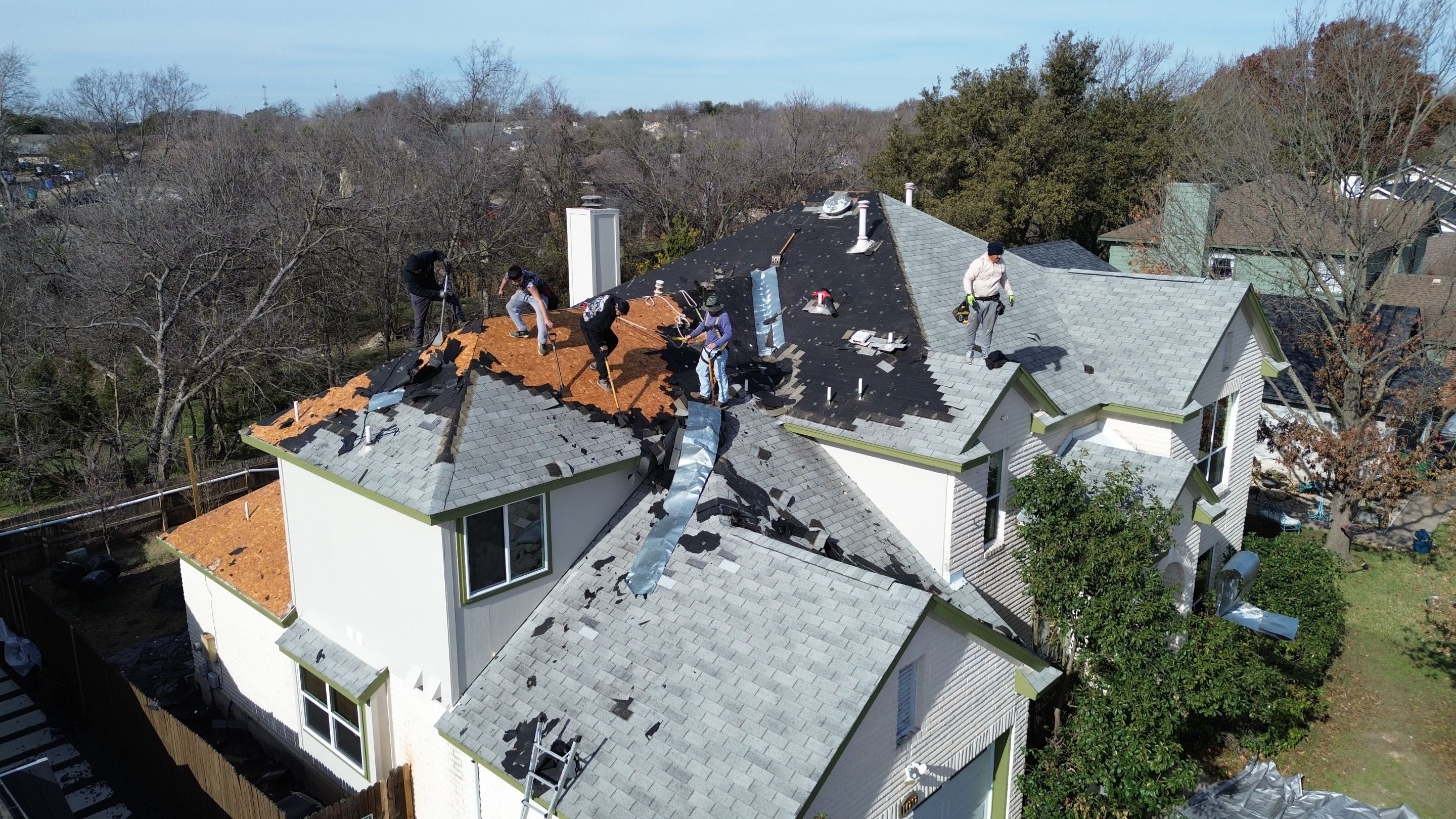 Three Tab Shingles To Metal Standing Seam by DeZign Roofing & Exteriors