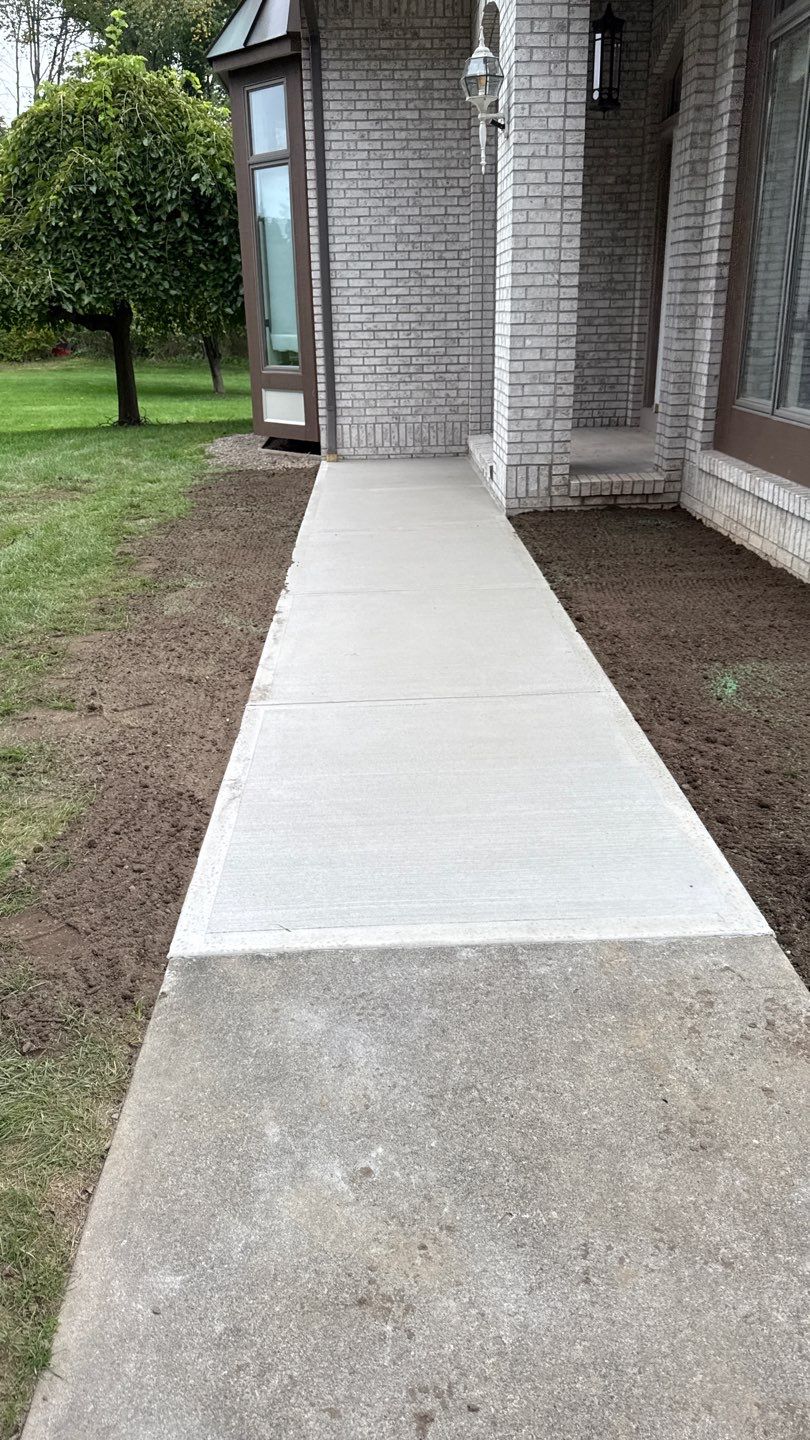 Broom finished concrete patio and walkways  by NG Masonry & Construction LLC