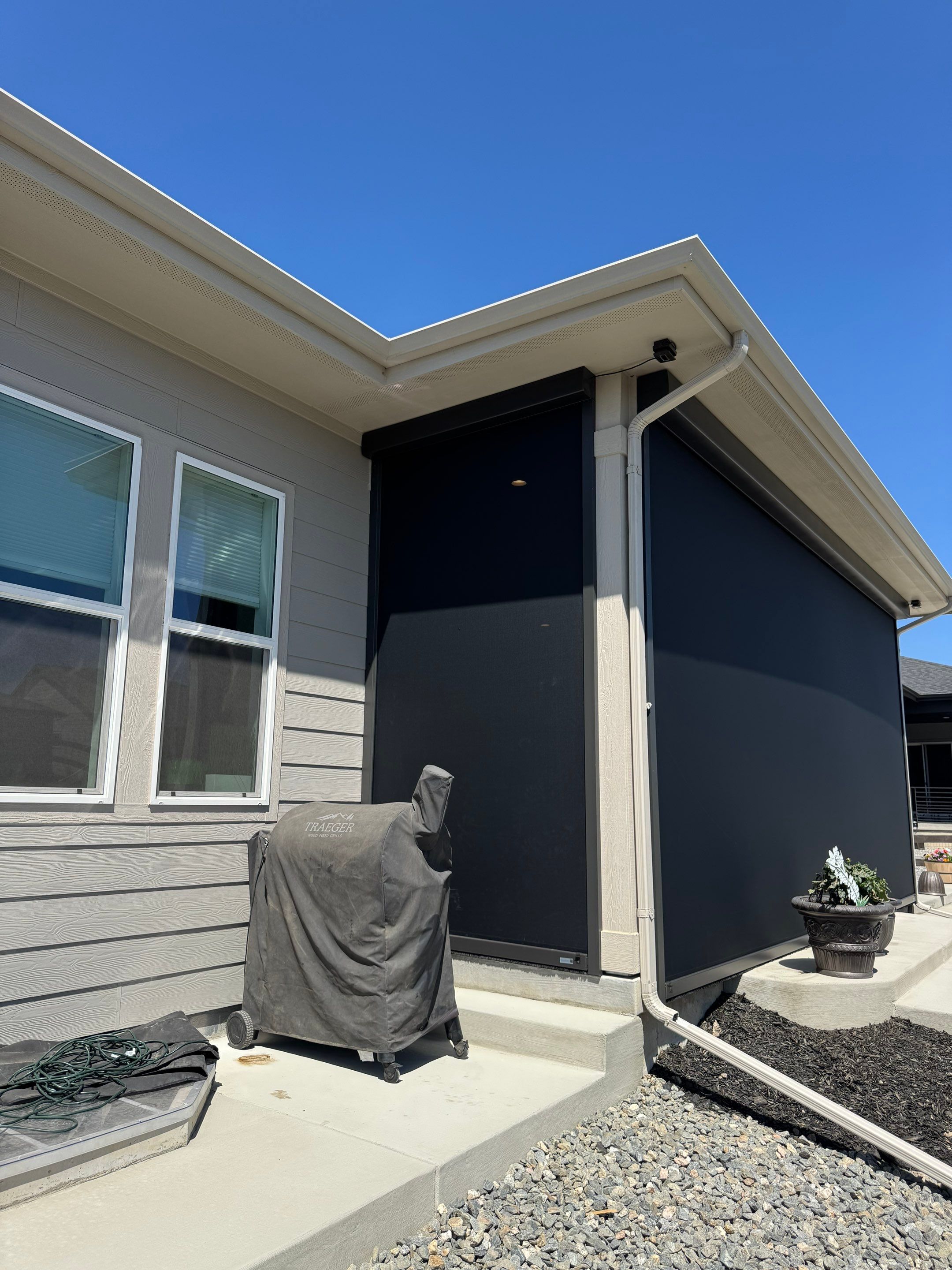 Retractable All-Weather Screen Installation for Castle Rock Covered Patio by Outdoor Solutions Colorado