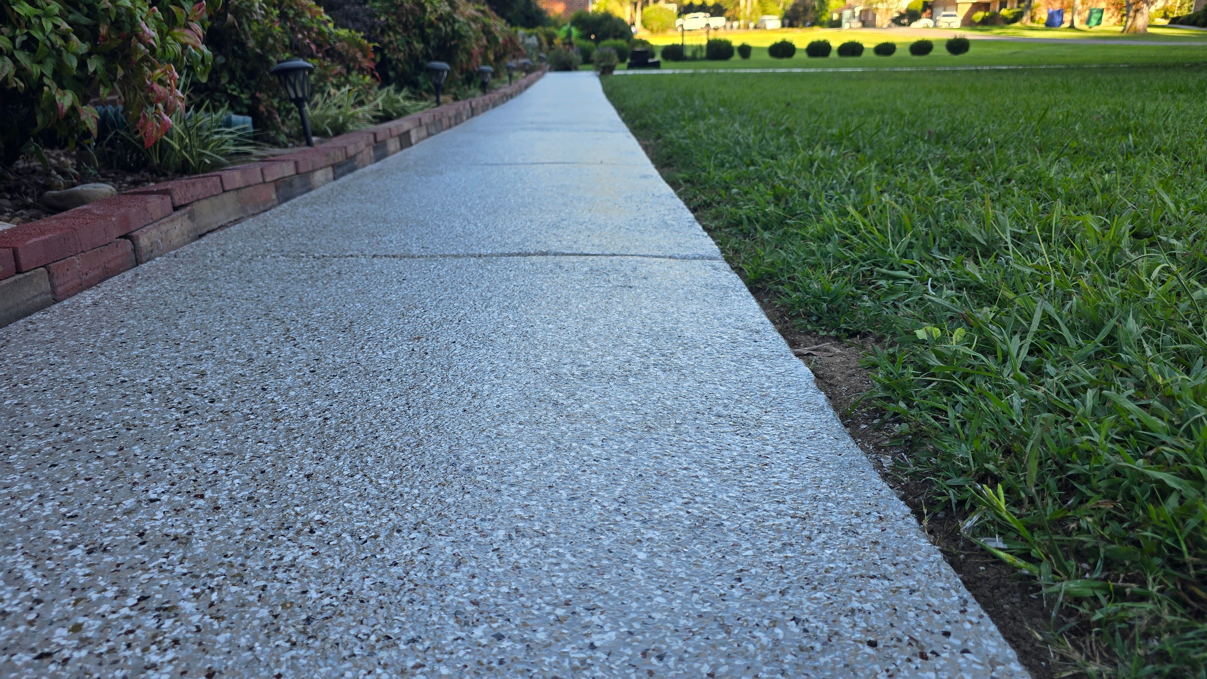 Driveway, Garage, Porch, and Sidewalk using Creekbed by Elite Floor Solutions