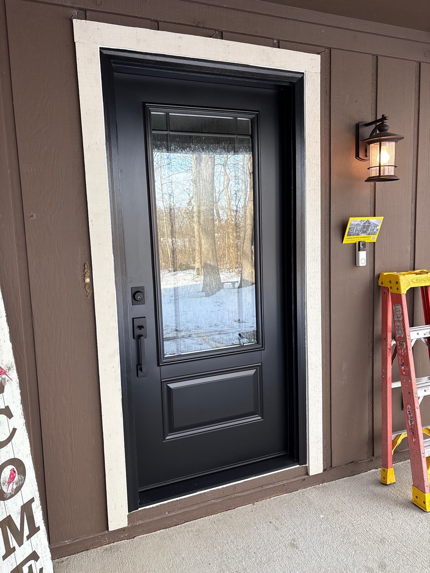 Modern Black Front Door Installation in Greenwood by Merrifield Exteriors, LLC