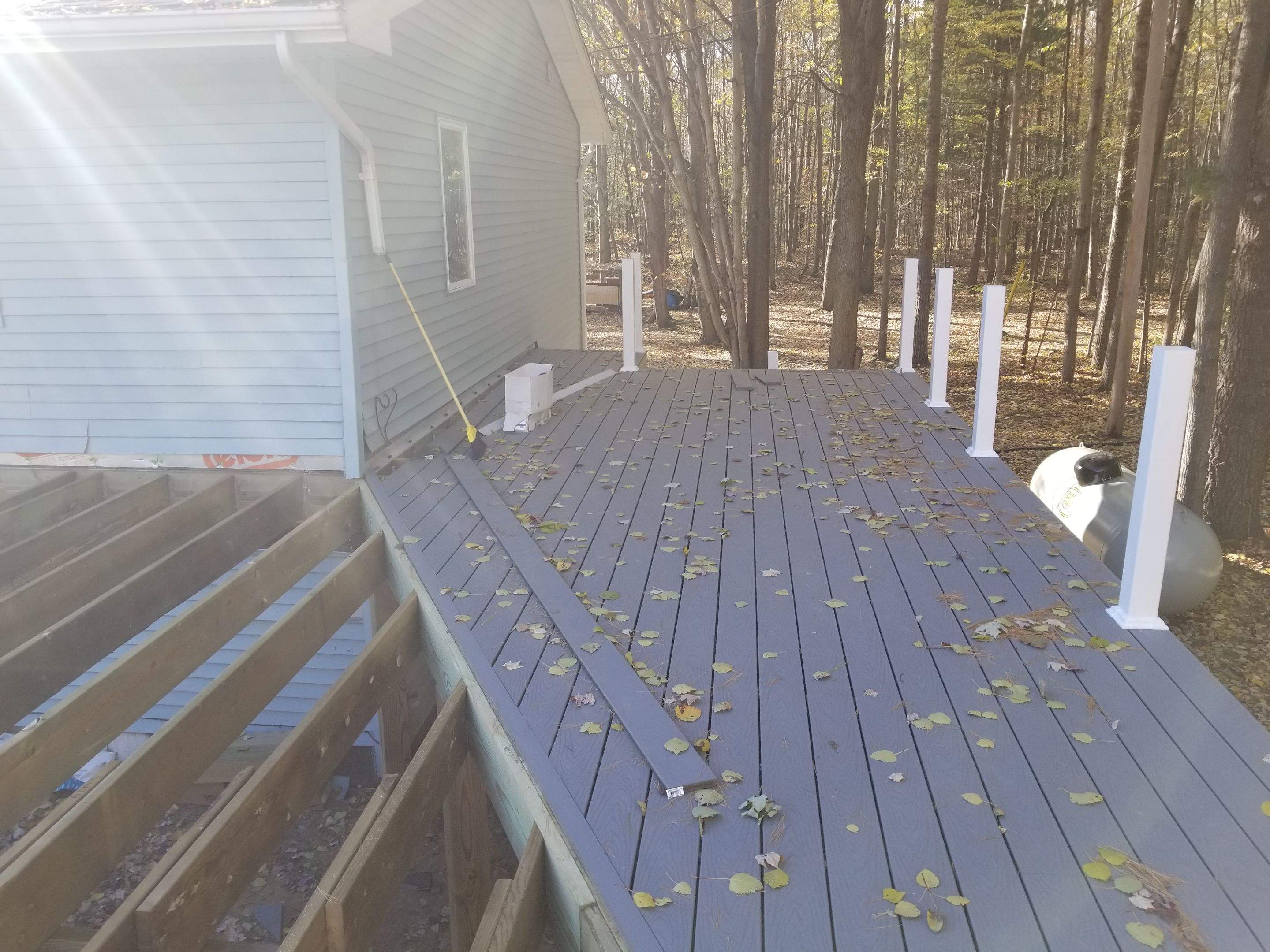 Sunroom and deck addition. by Energy Plus Home Improvements